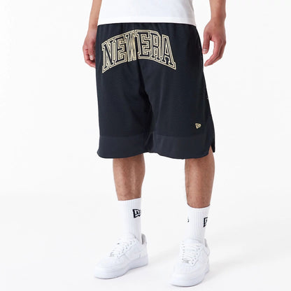 The Male model is wearing New Era Black Oversized Mesh Shorts 2