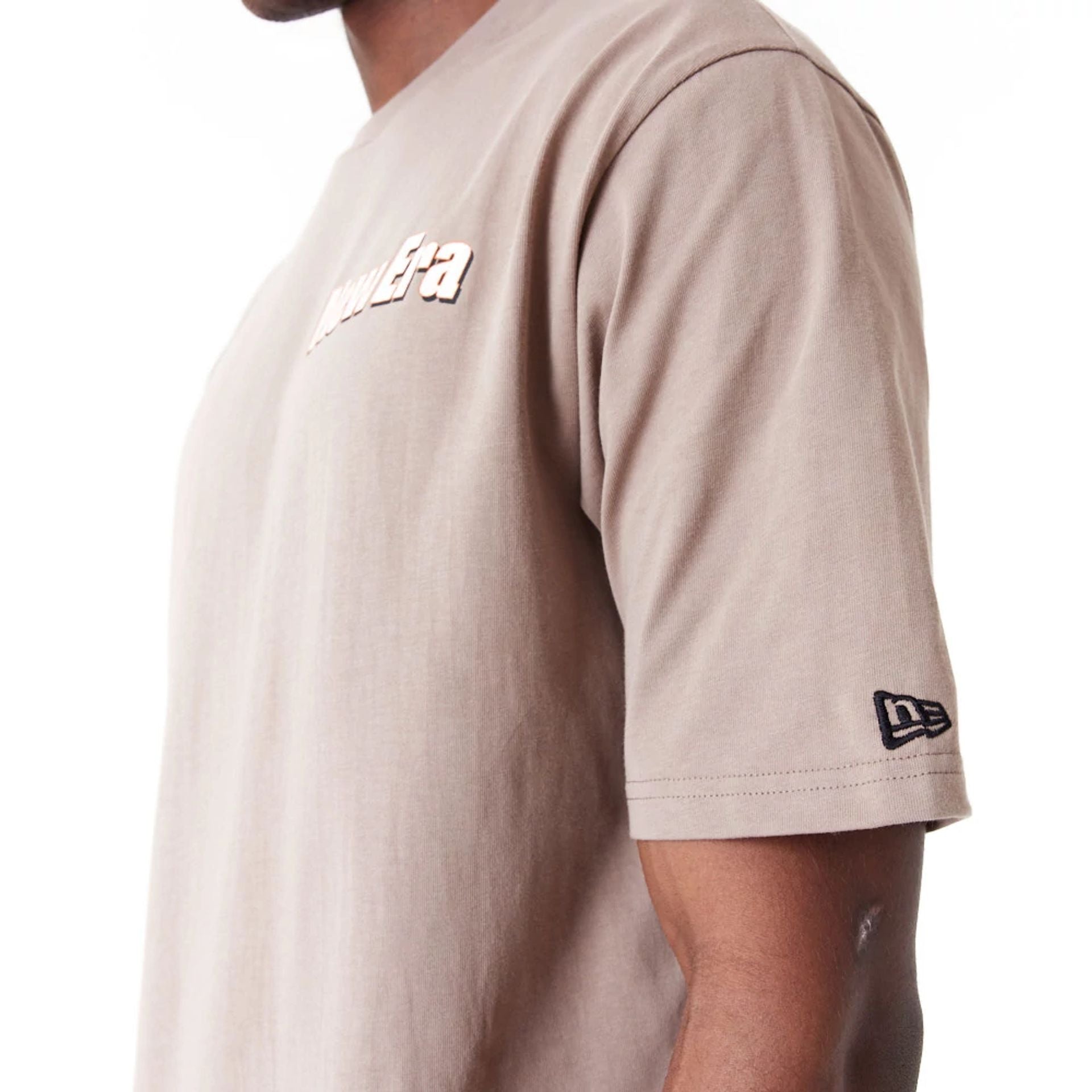 The Male model is wearing New Era Character Graphic Brown Oversized T-Shirt 3