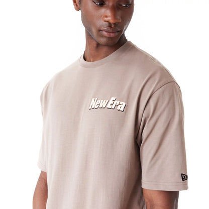 The Male model is wearing New Era Character Graphic Brown Oversized T-Shirt 5