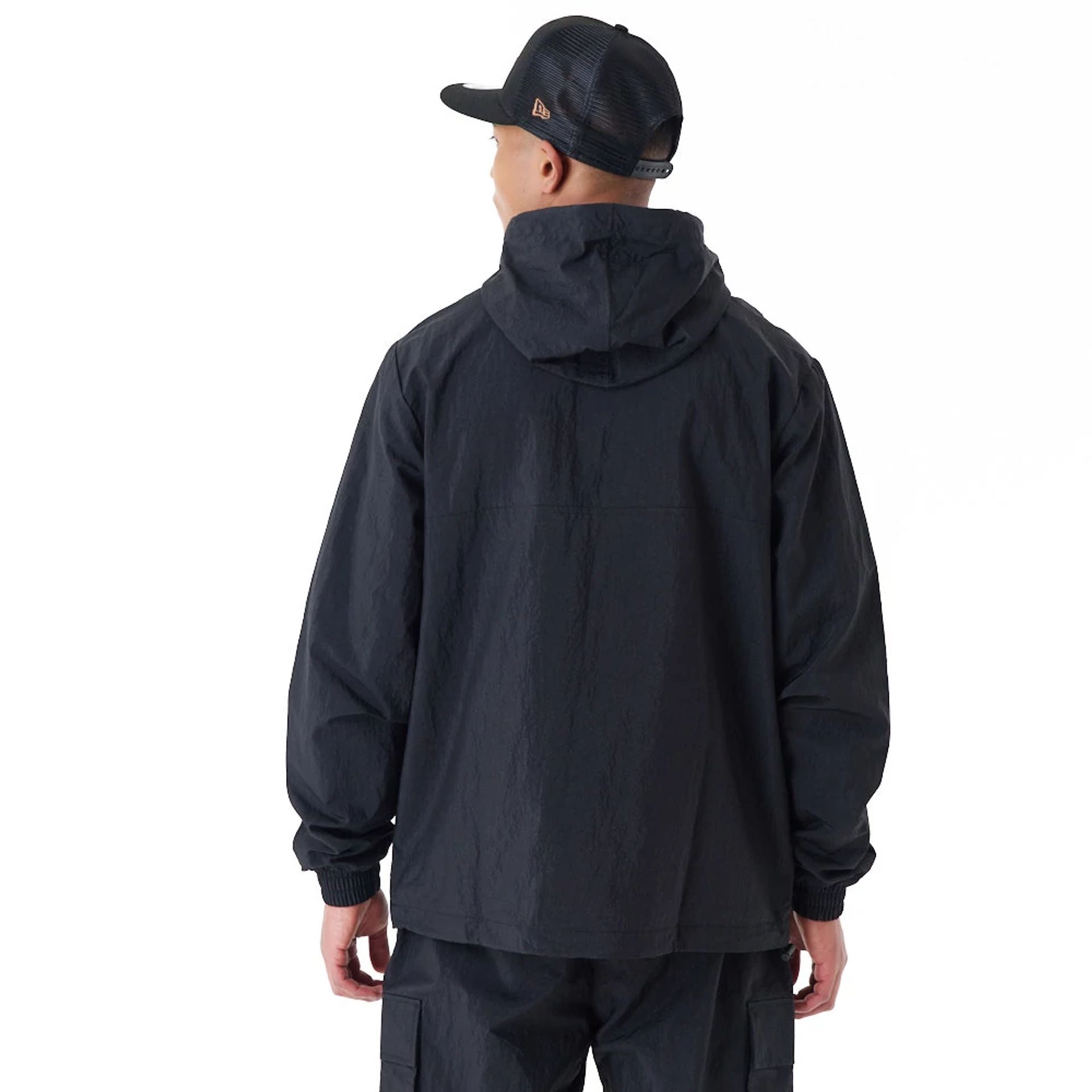 The Male model is wearing New Era Windbreaker Black Windbreaker 5