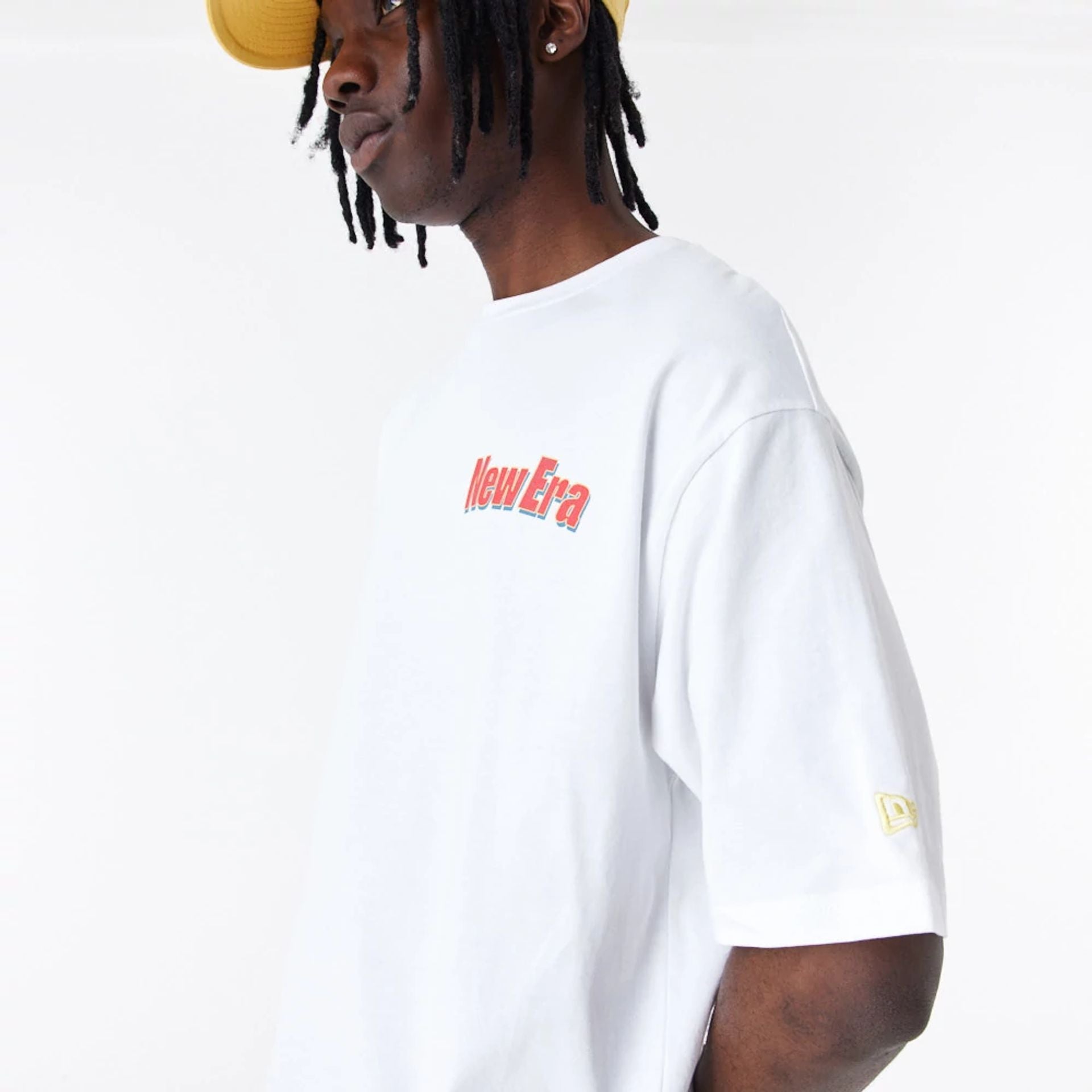 The Male model is wearing New Era Character Graphic White Oversized T-Shirt 3