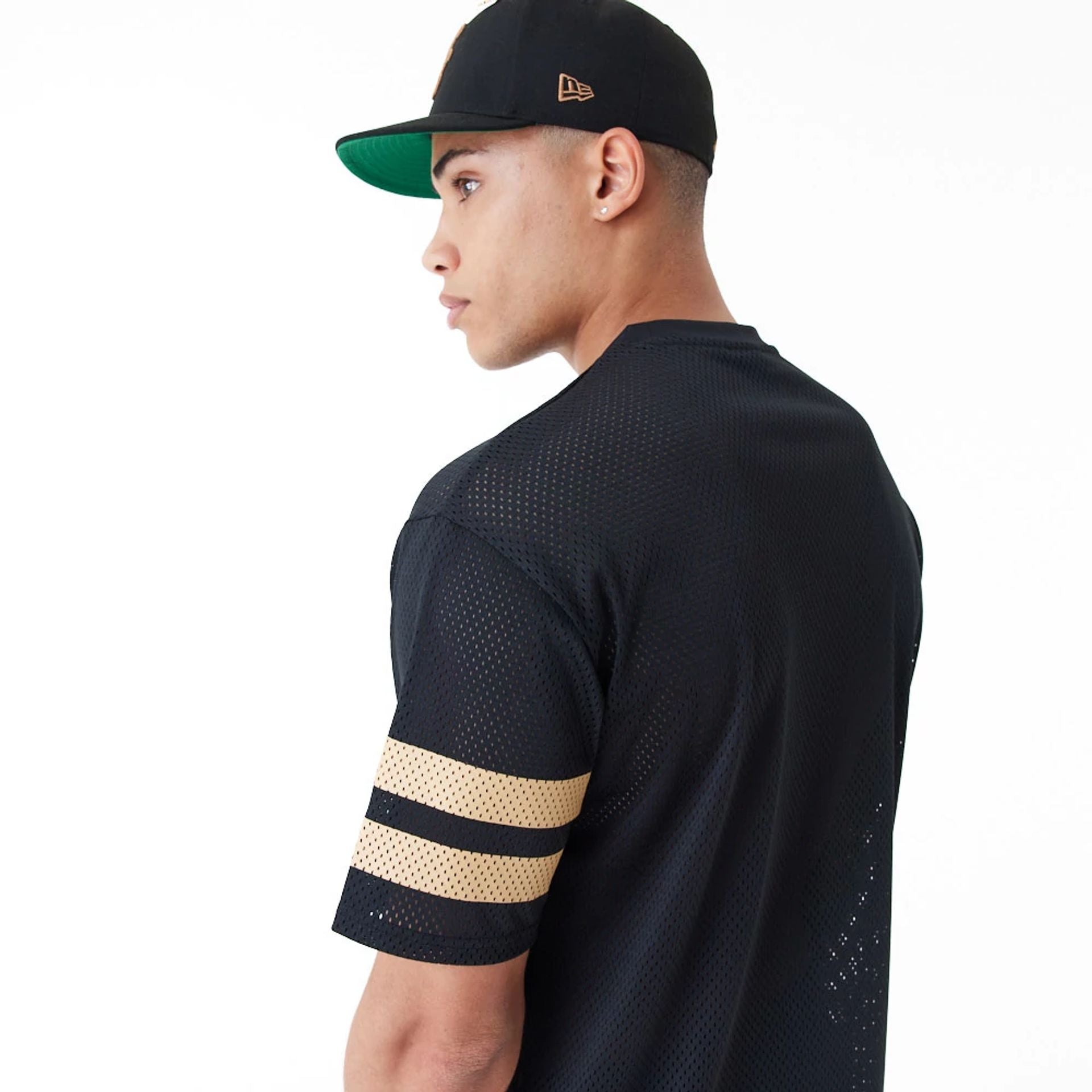 The Male model is wearing New Era Mesh Black Oversized T-Shirt 4