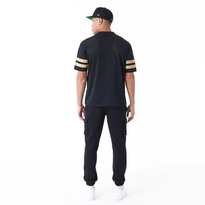 The Male model is wearing New Era Mesh Black Oversized T-Shirt 3