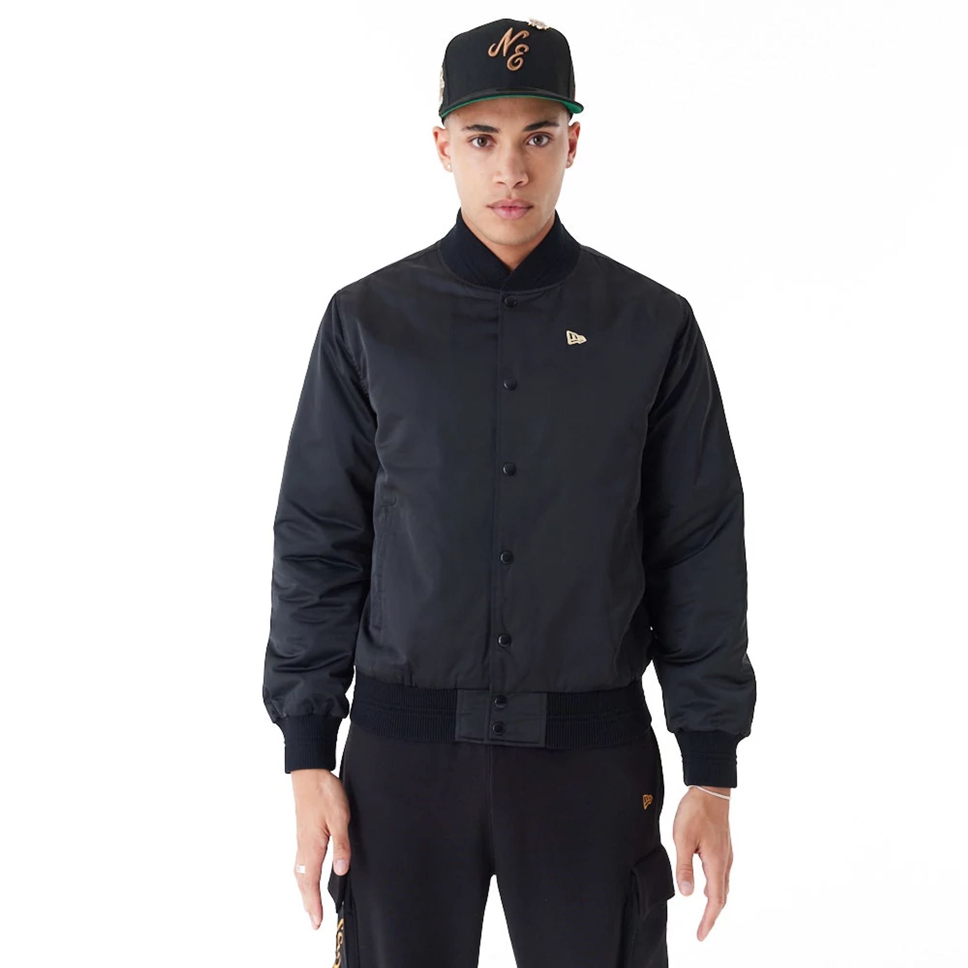 The Male model is wearing New Era Satin Black Bomber Jacket 1