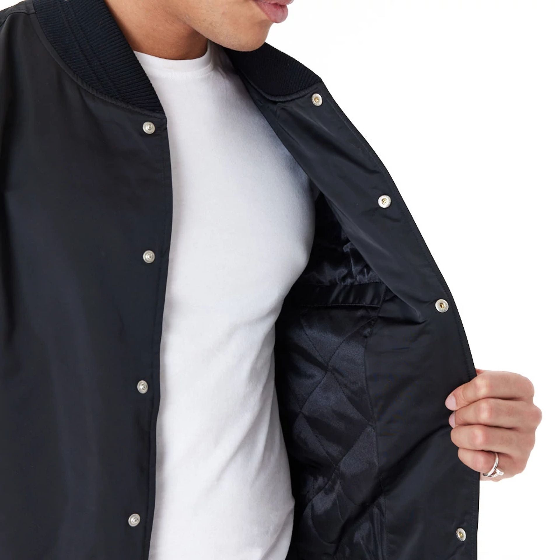 The Male model is wearing New Era Satin Black Bomber Jacket 2