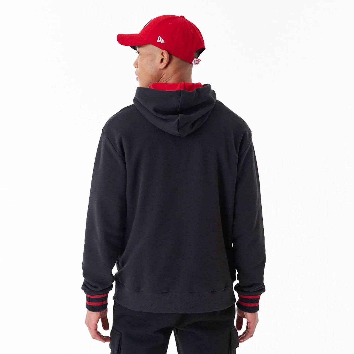 The Male model is wearing San Francisco 49Ers NFL Black Oversized Pullover Hoodie 2