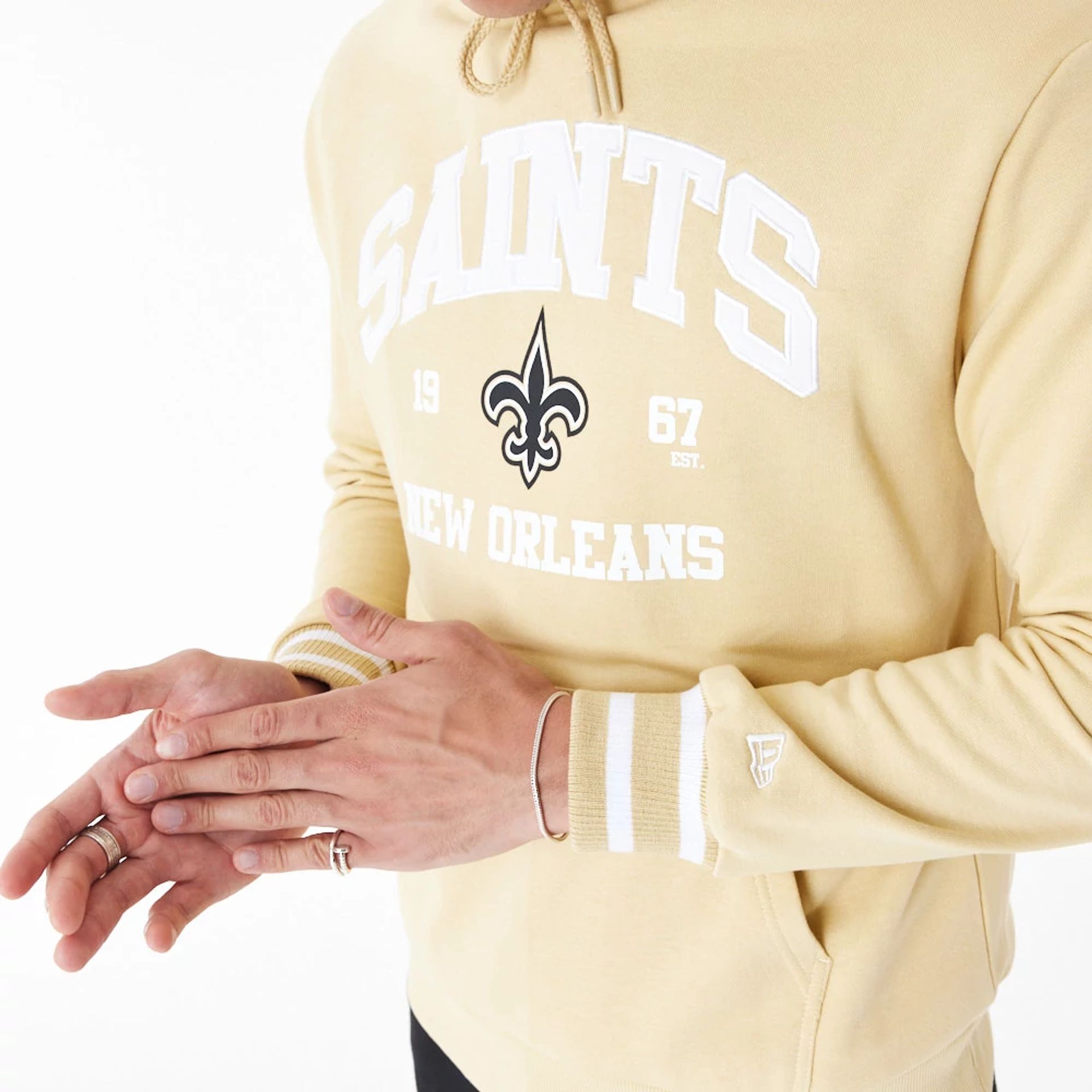 The Male model is wearing New Orleans Saints NFL Stone Oversized Pullover Hoodie 9