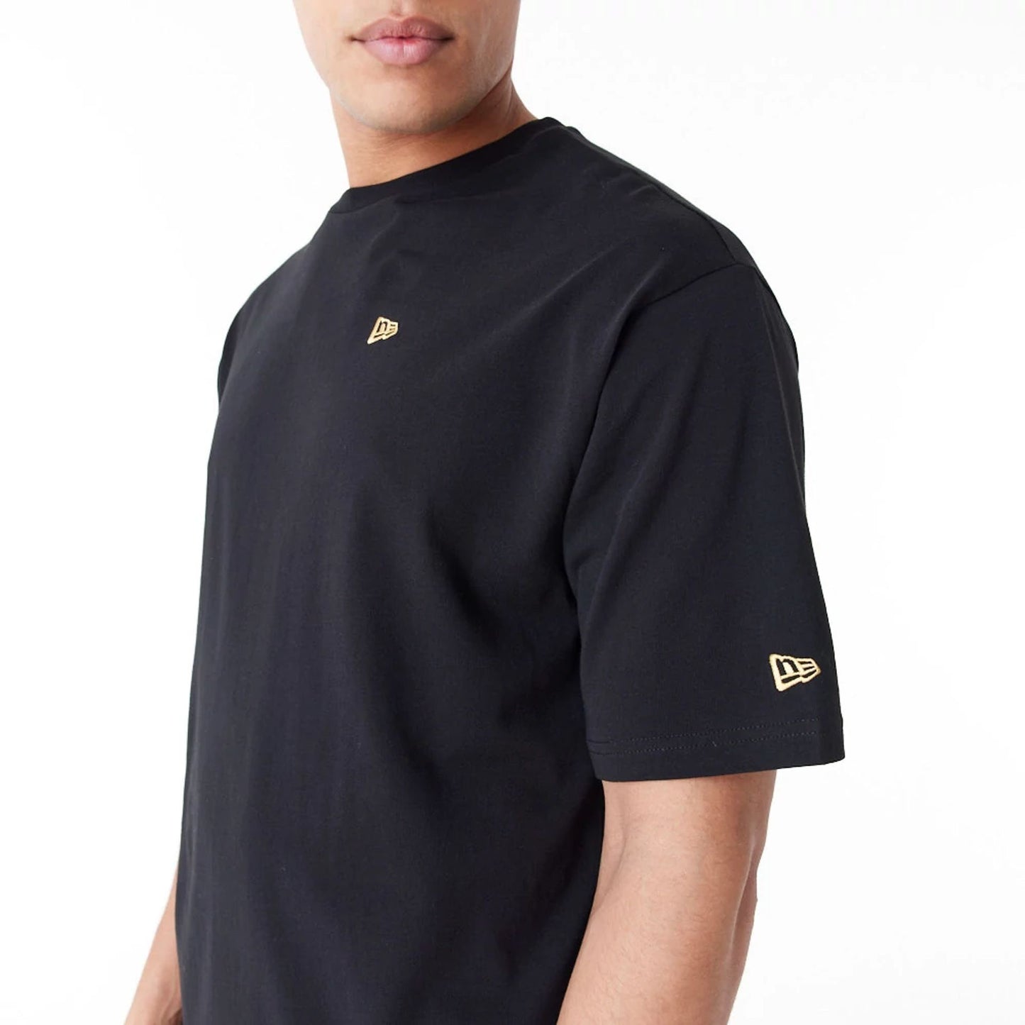 The Male model is wearing New Era Graphic Black Oversized T-Shirt 2