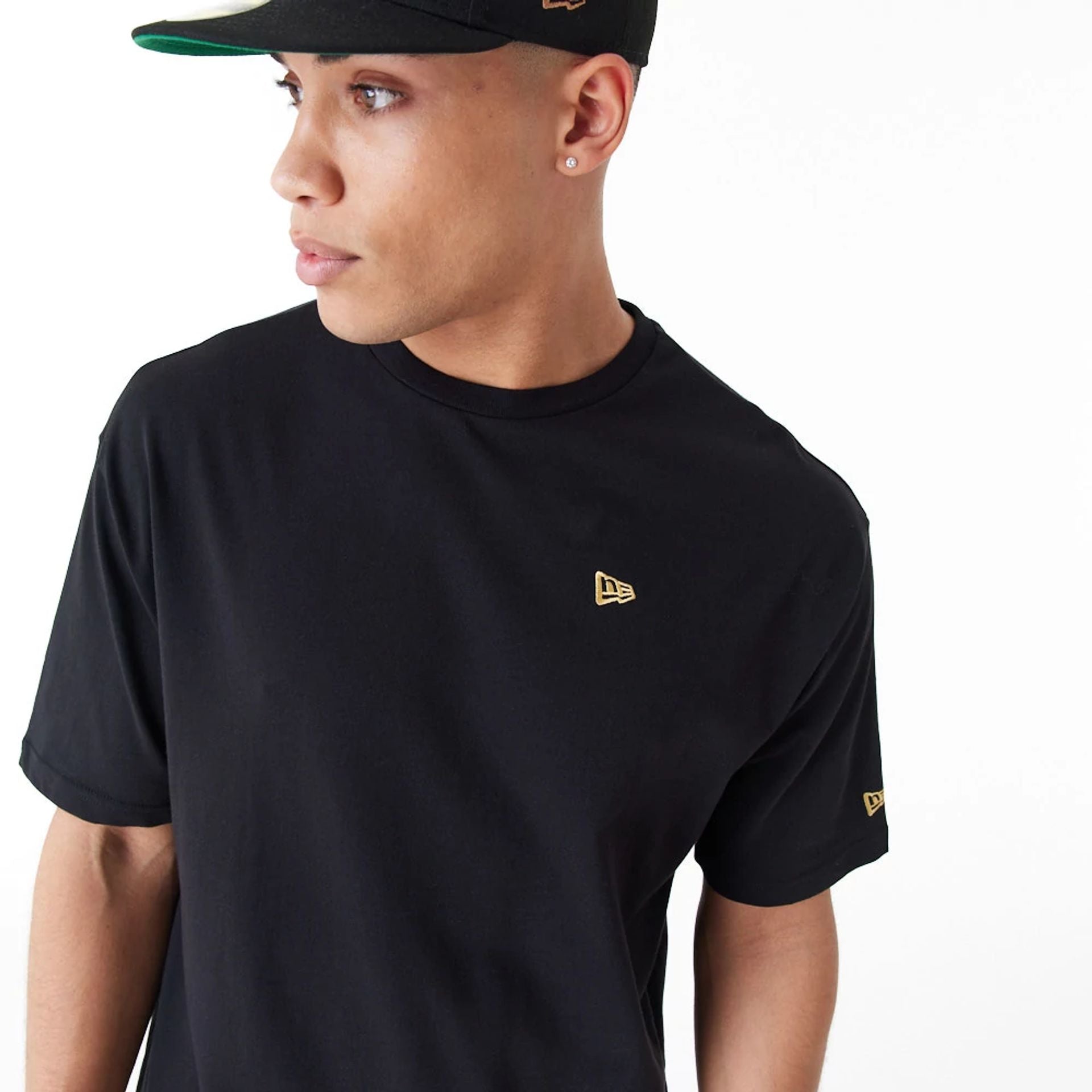 The Male model is wearing New Era Graphic Black Oversized T-Shirt 6