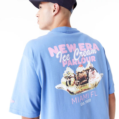 The Male model is wearing New Era Food Graphic Blue Oversized T-Shirt 7