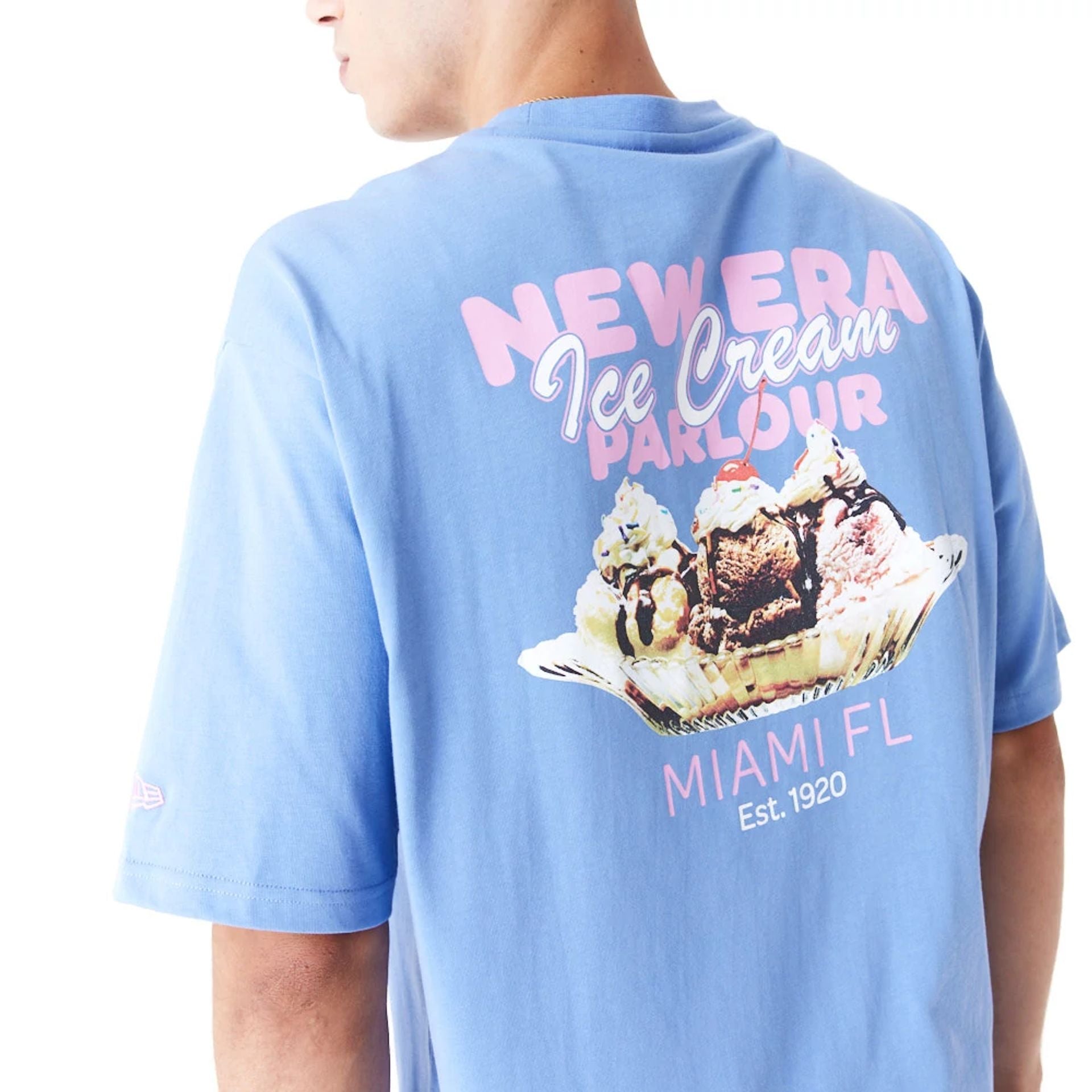 The Male model is wearing New Era Food Graphic Blue Oversized T-Shirt 2