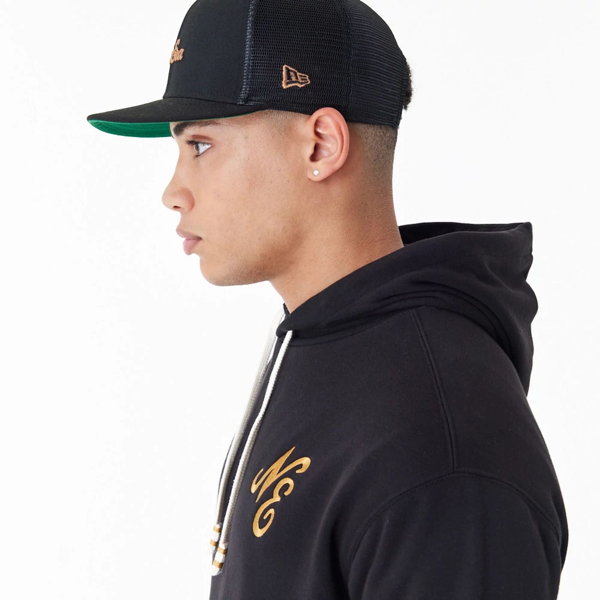 The Male model is wearing New Era Script Logo Black Oversized Pullover Hoodie 4