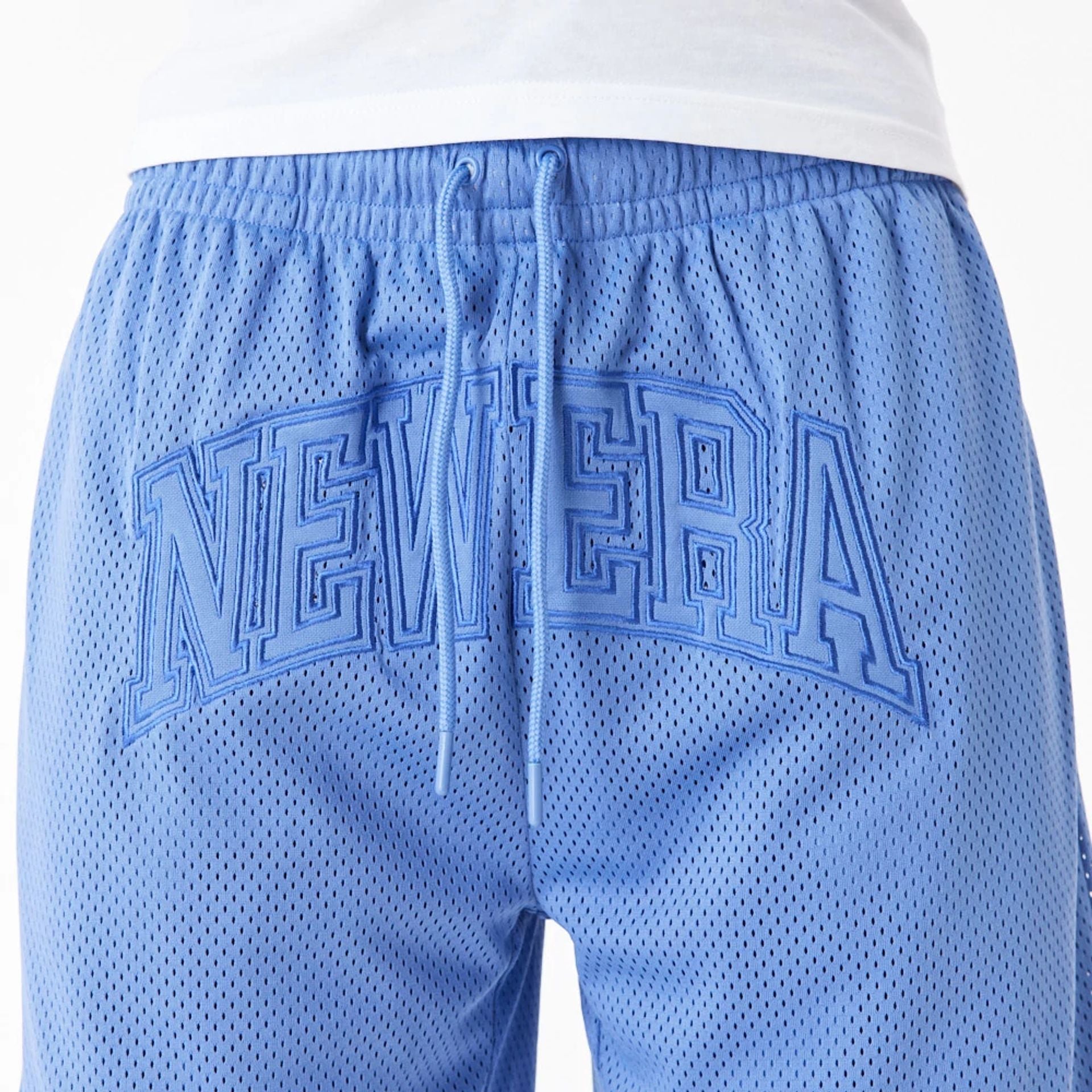 The Male model is wearing New Era Arch Logo Blue Mesh Shorts 4