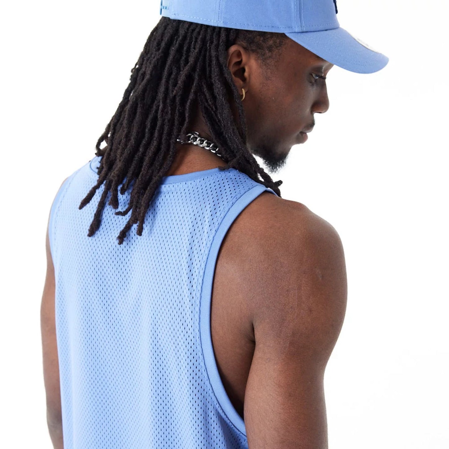 The Male model is wearing New Era Arch Logo Blue Mesh Tank Top 2