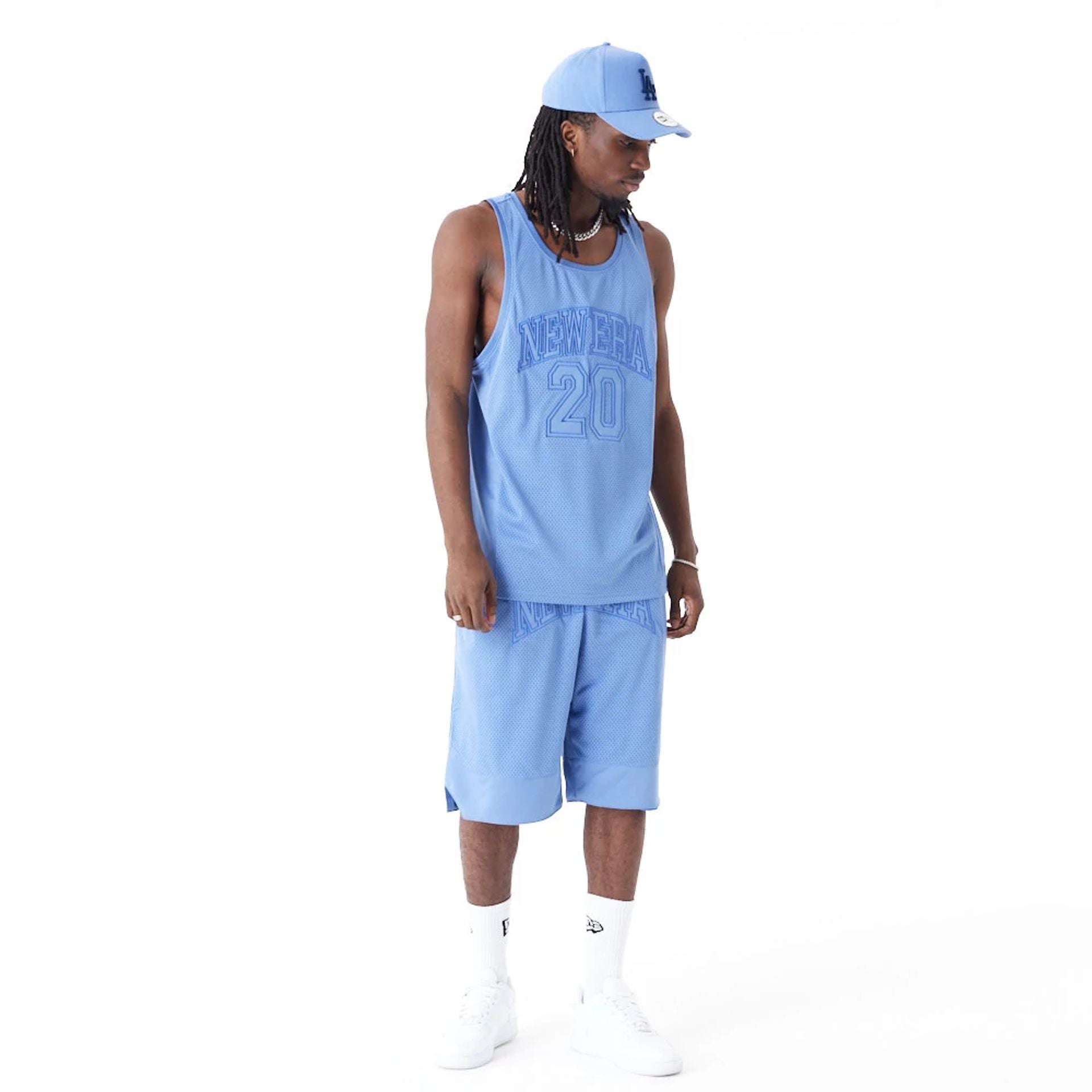 The Male model is wearing New Era Arch Logo Blue Mesh Tank Top 8