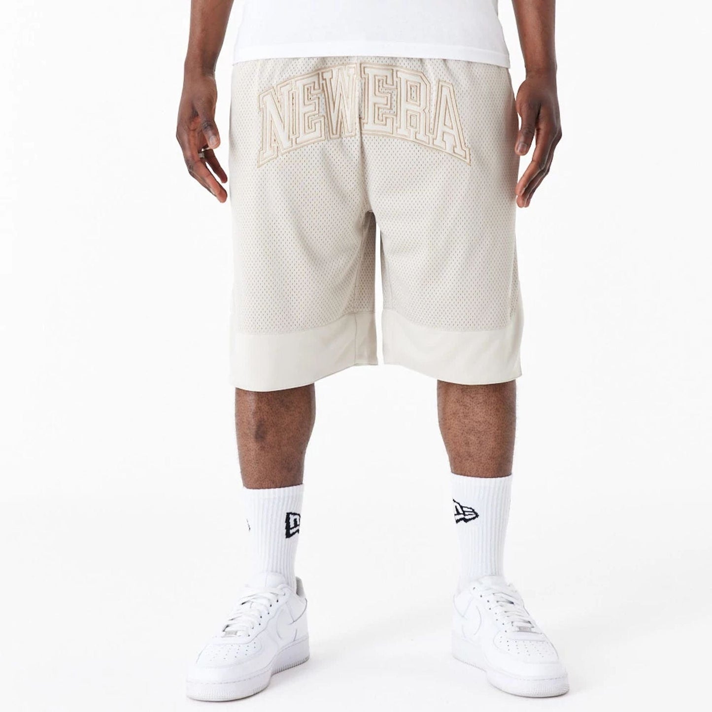 The Male model is wearing New Era Arch Logo Stone Mesh Shorts 1