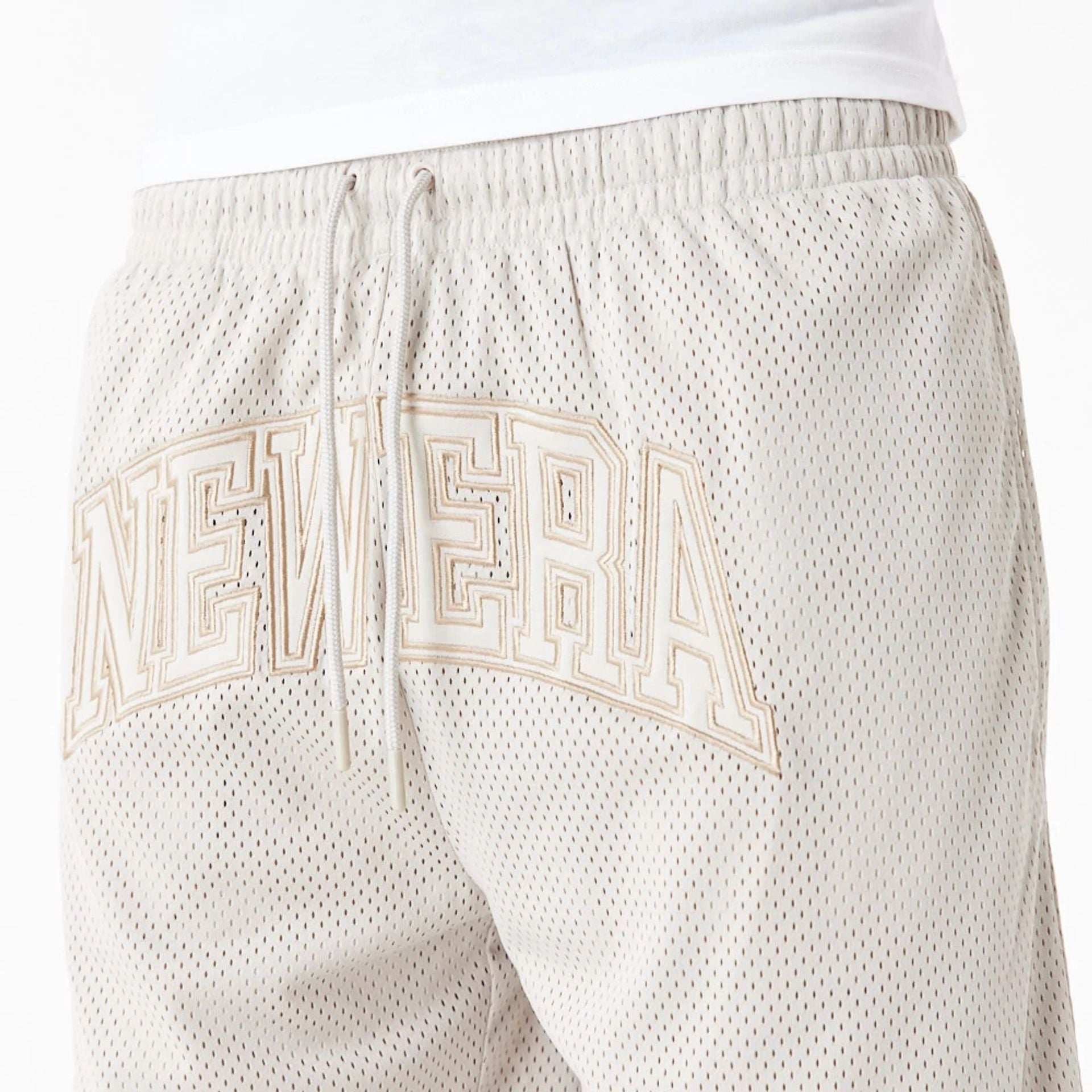 The Male model is wearing New Era Arch Logo Stone Mesh Shorts 2