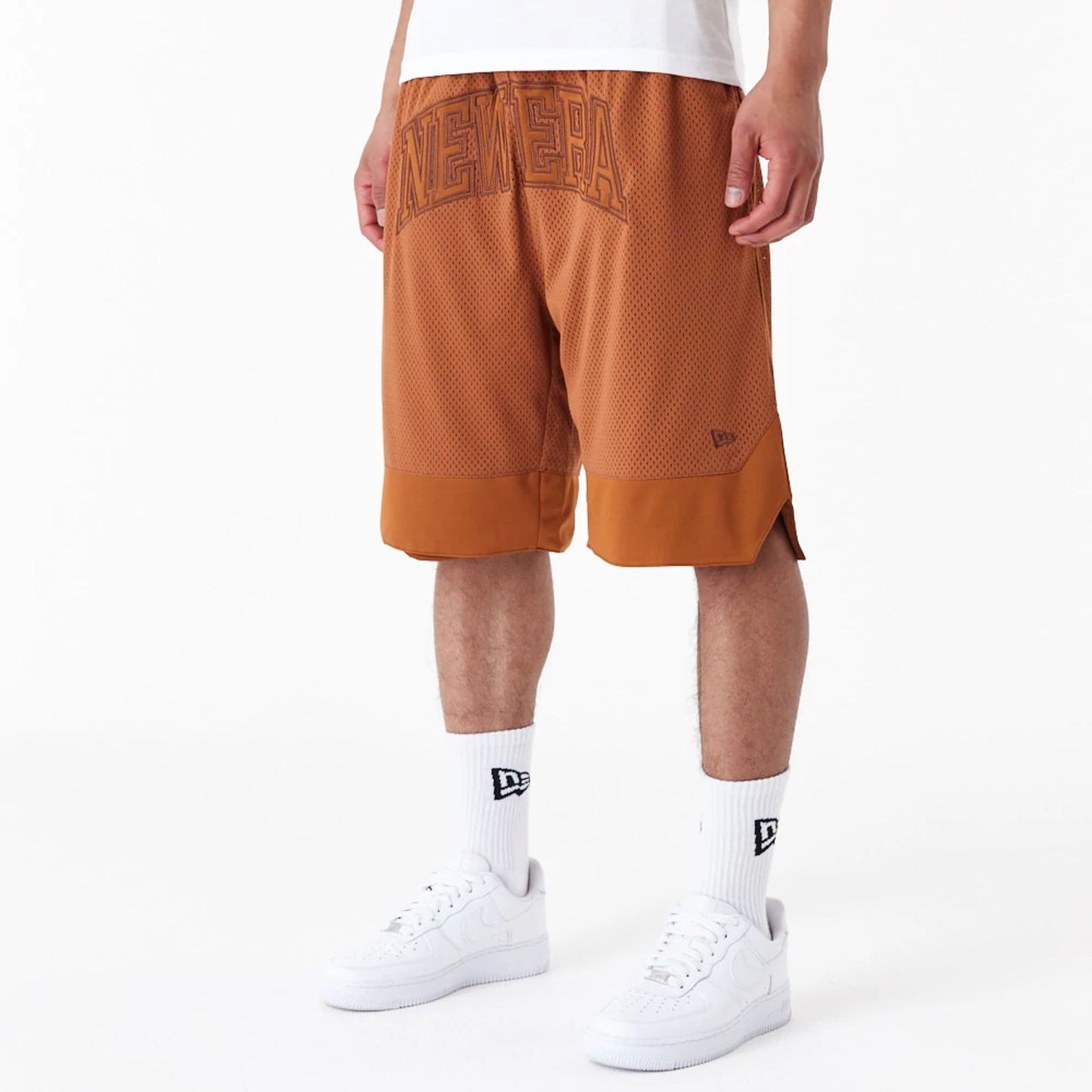 The Male model is wearing New Era Arch Logo Brown Mesh Shorts 2