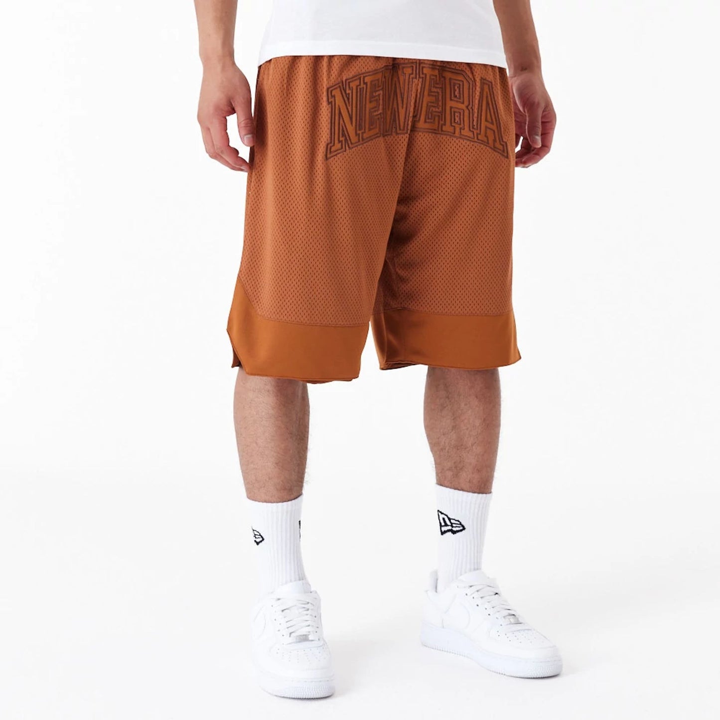 The Male model is wearing New Era Arch Logo Brown Mesh Shorts 5