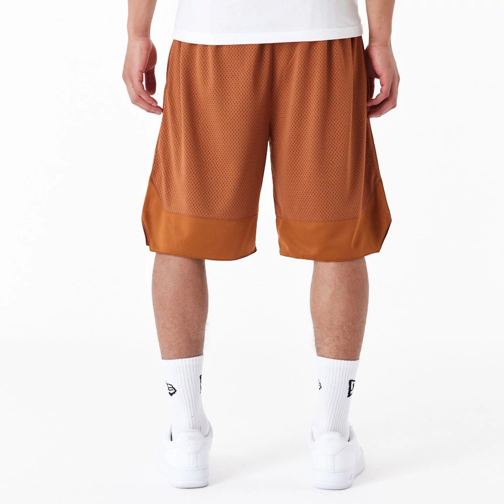 The Male model is wearing New Era Arch Logo Brown Mesh Shorts 7