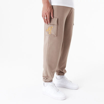 The Male model is wearing New Era Script Brown Cargo Joggers 7