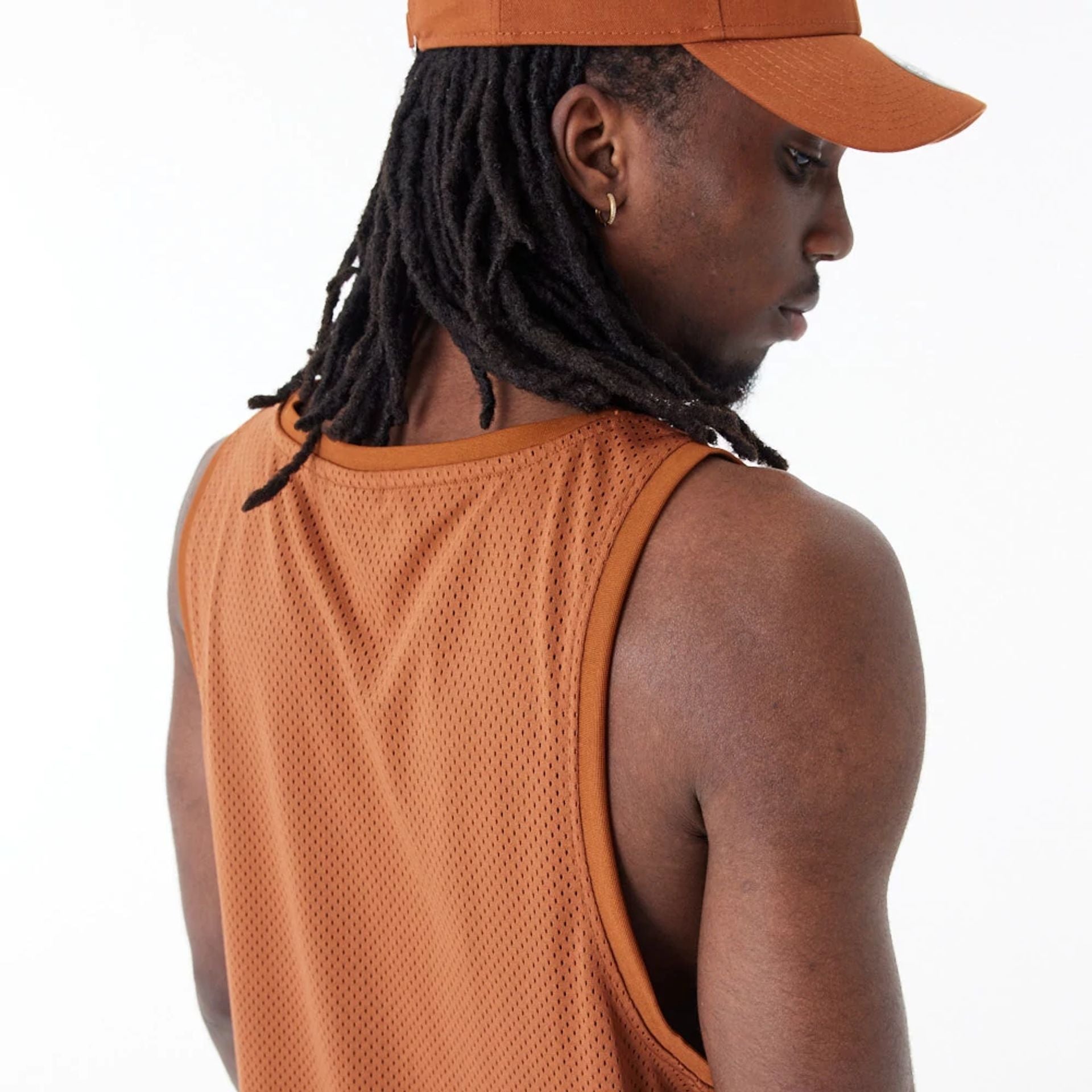 The Male model is wearing New Era Arch Logo Brown Mesh Tank Top 6