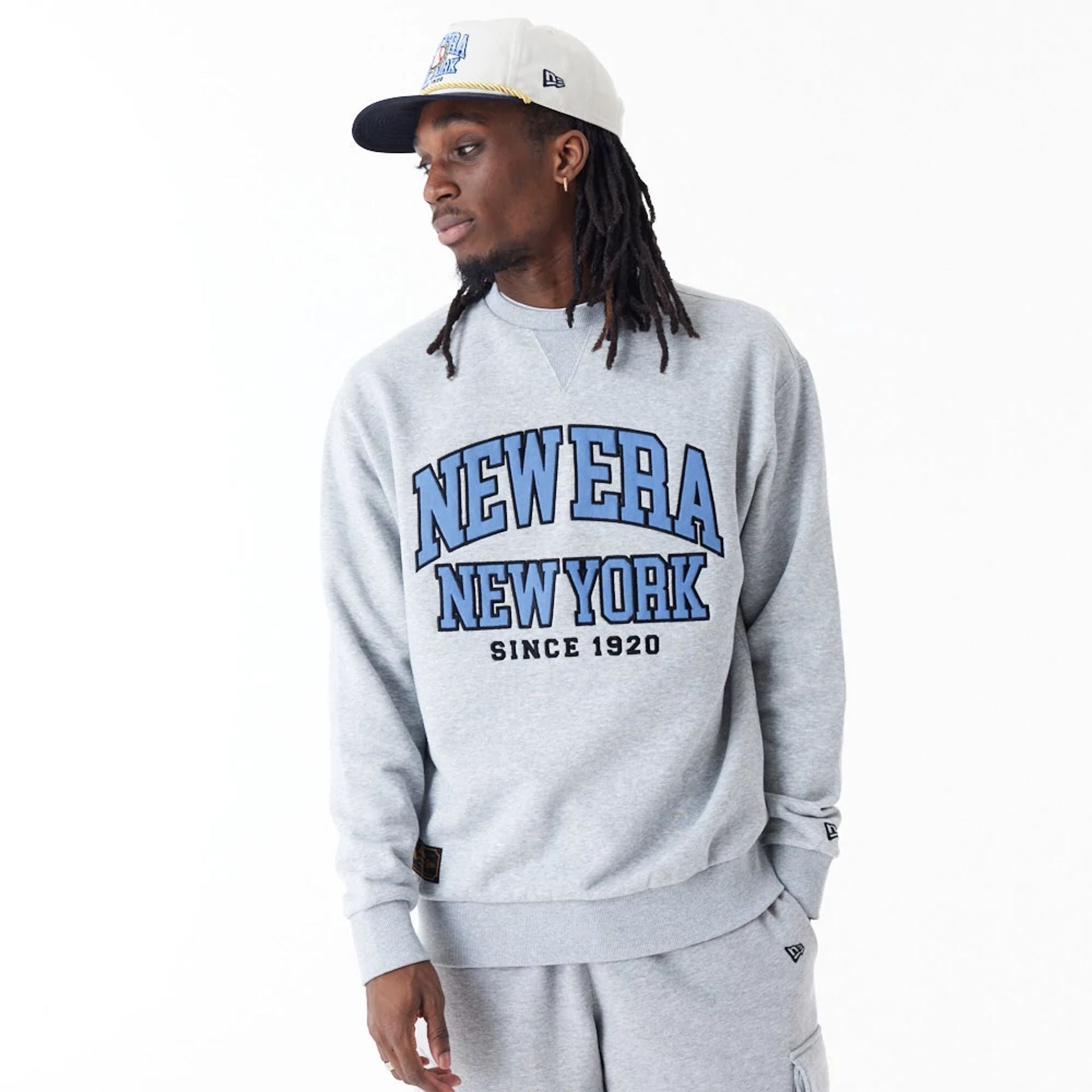 The Male model is wearing New Era Arch Graphic Grey Crew Neck Sweatshirt 6