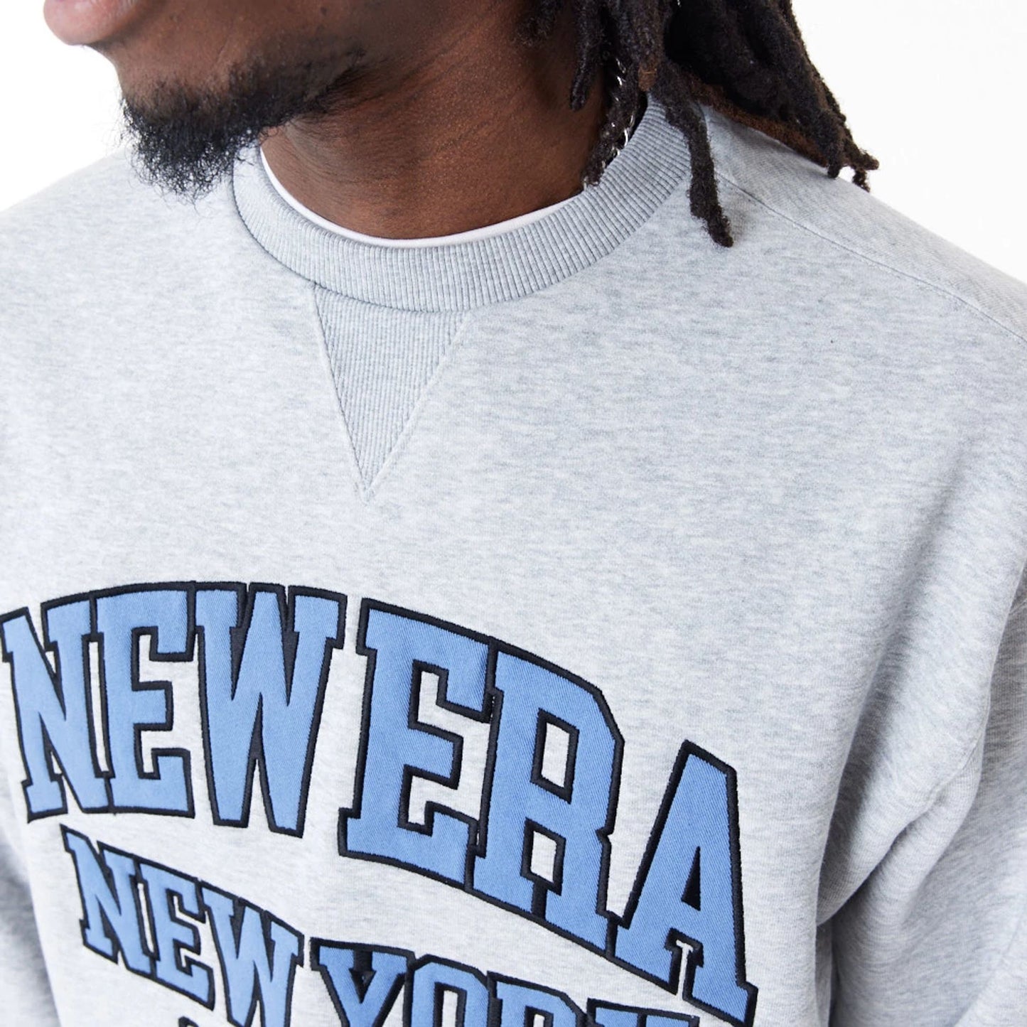 The Male model is wearing New Era Arch Graphic Grey Crew Neck Sweatshirt 2