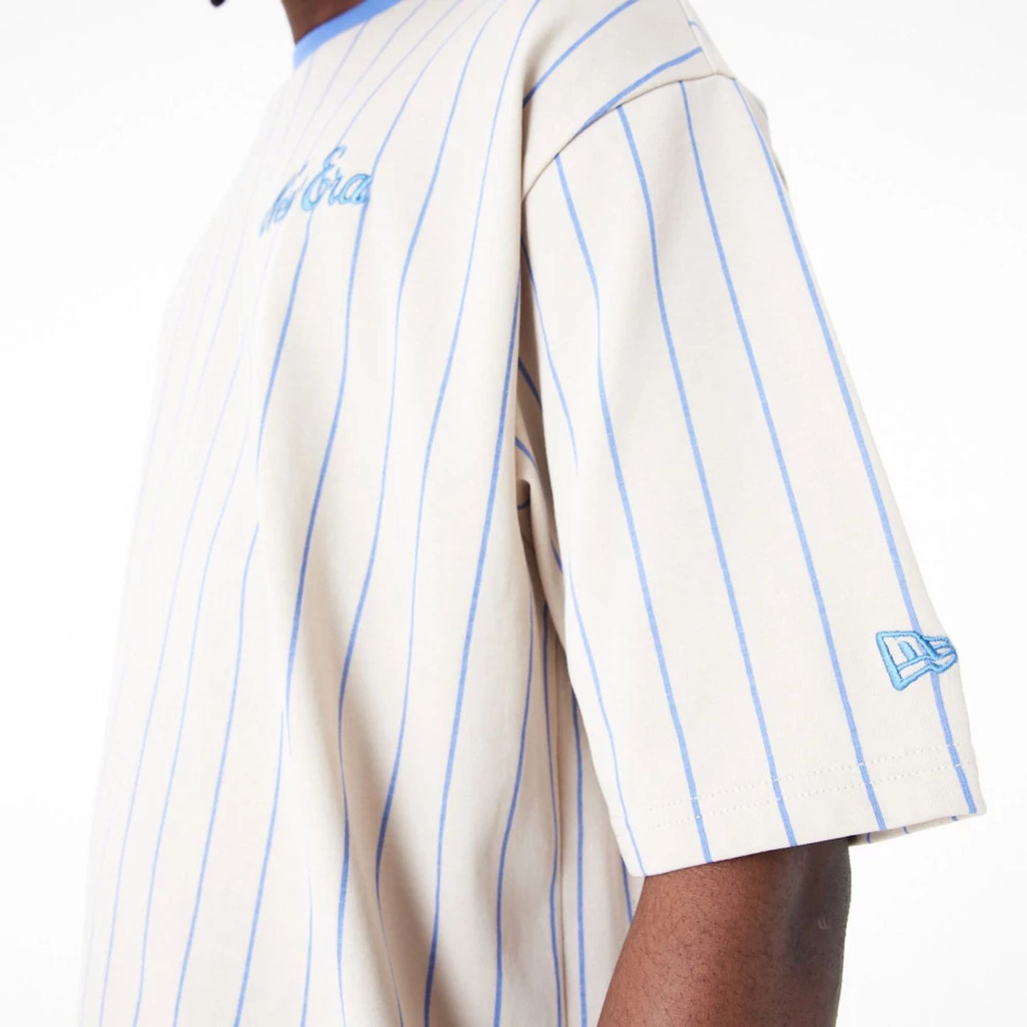 The Male model is wearing New Era Pinstripe Stone Oversized T-Shirt 3