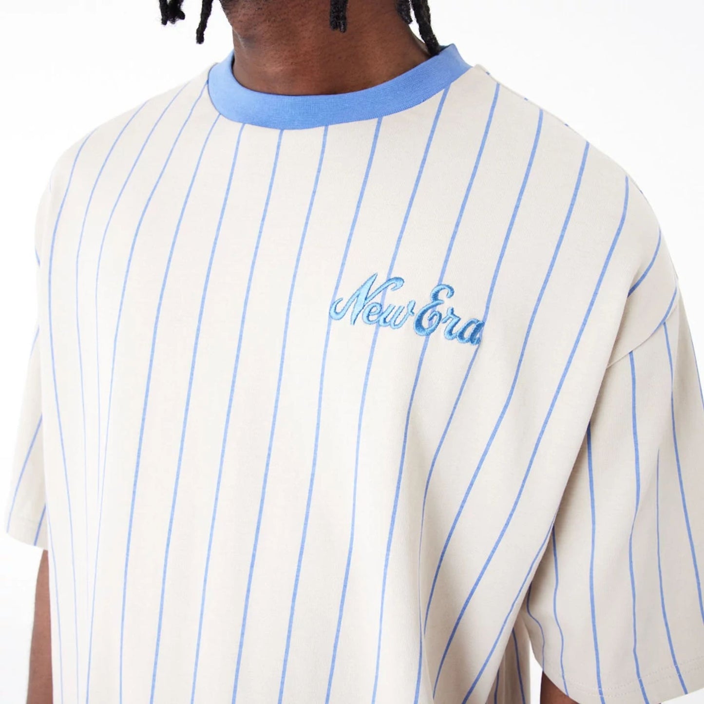 The Male model is wearing New Era Pinstripe Stone Oversized T-Shirt 4