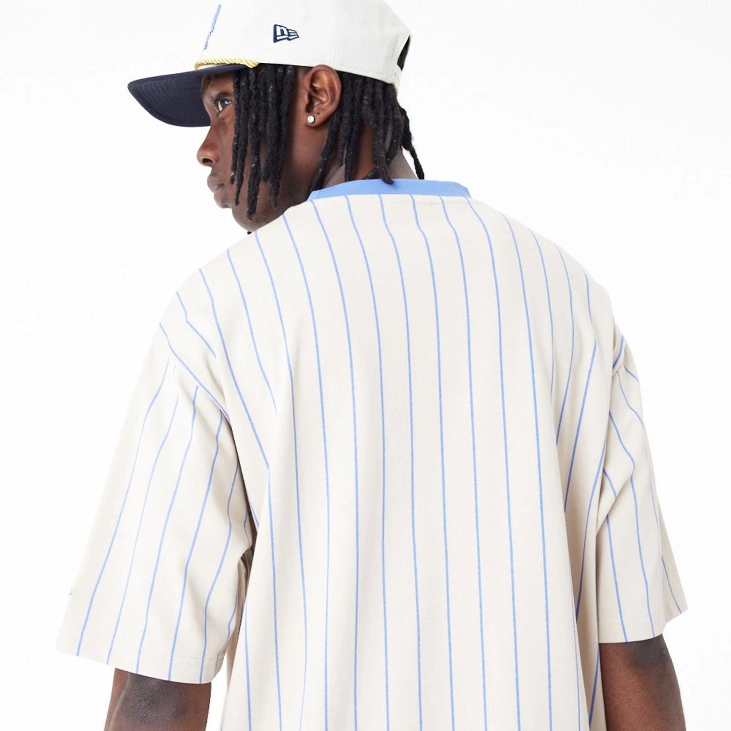 The Male model is wearing New Era Pinstripe Stone Oversized T-Shirt 5