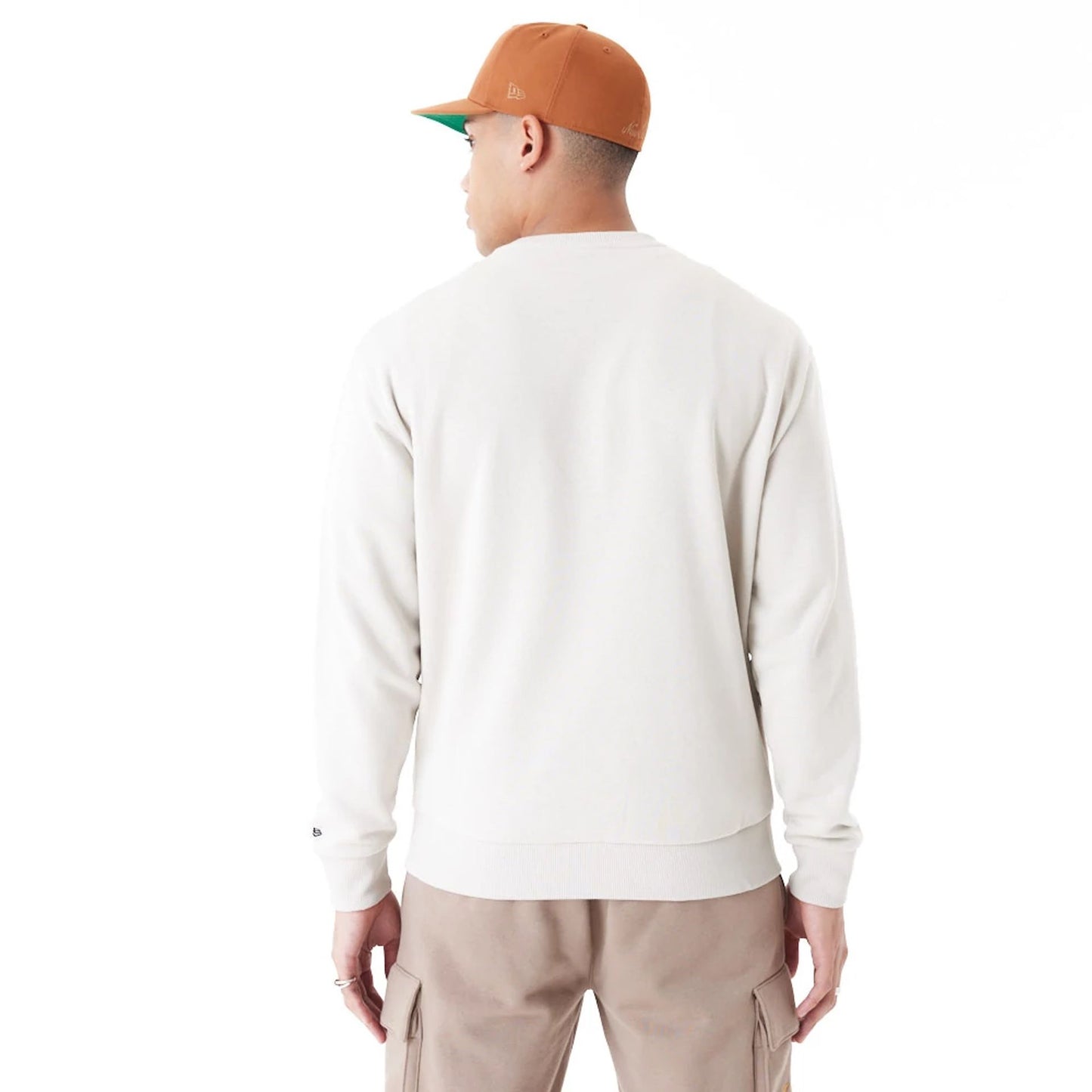 The Male model is wearing New Era Arch Graphic Stone Crew Neck Sweatshirt 5