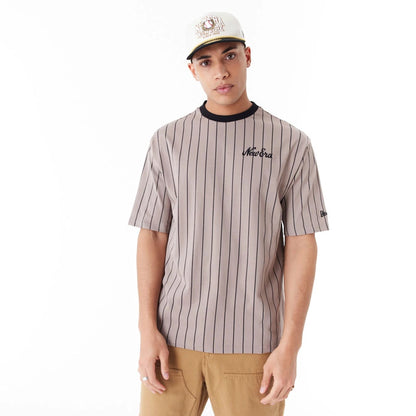 The Male model is wearing New Era Pinstripe Brown Oversized T-Shirt 1