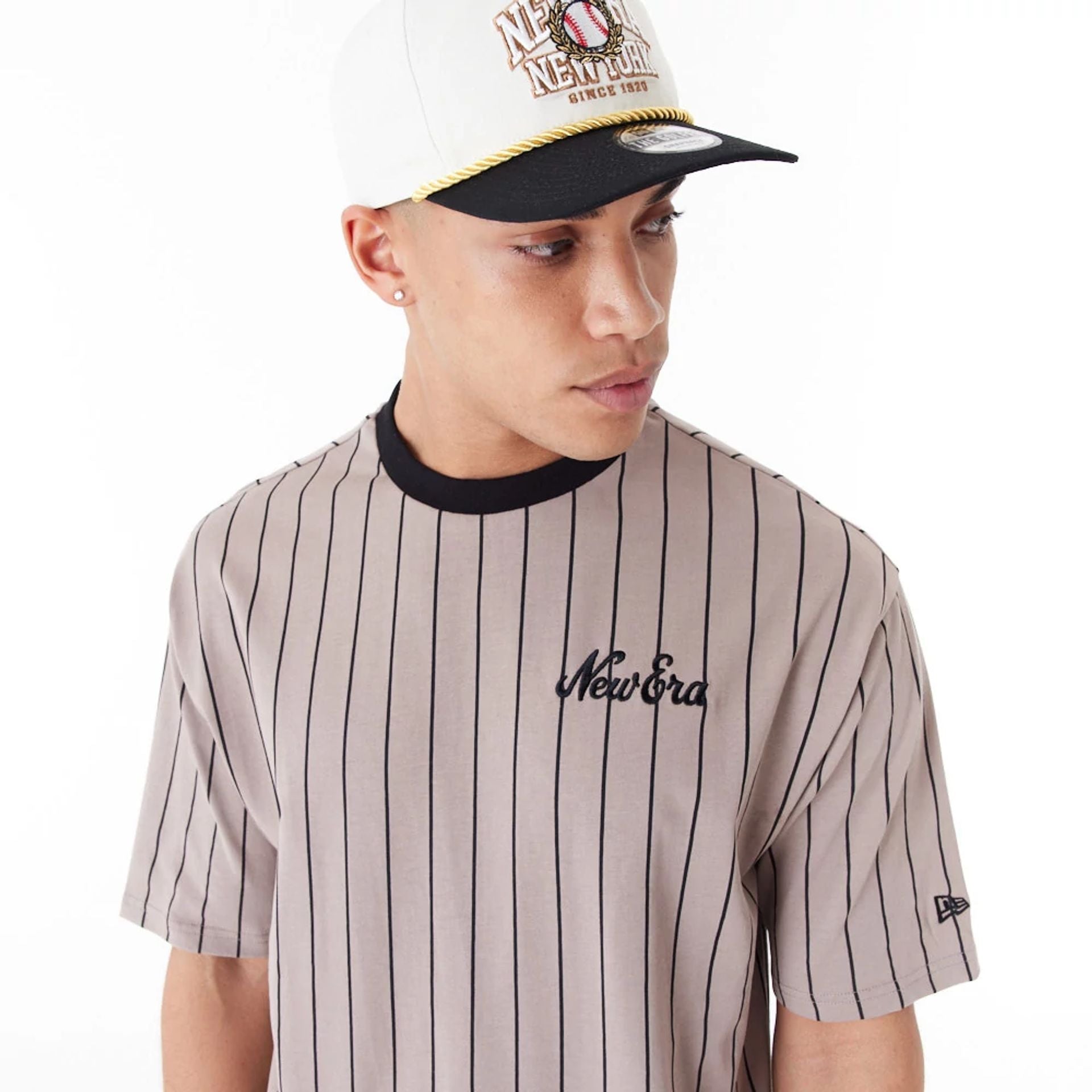 The Male model is wearing New Era Pinstripe Brown Oversized T-Shirt 5