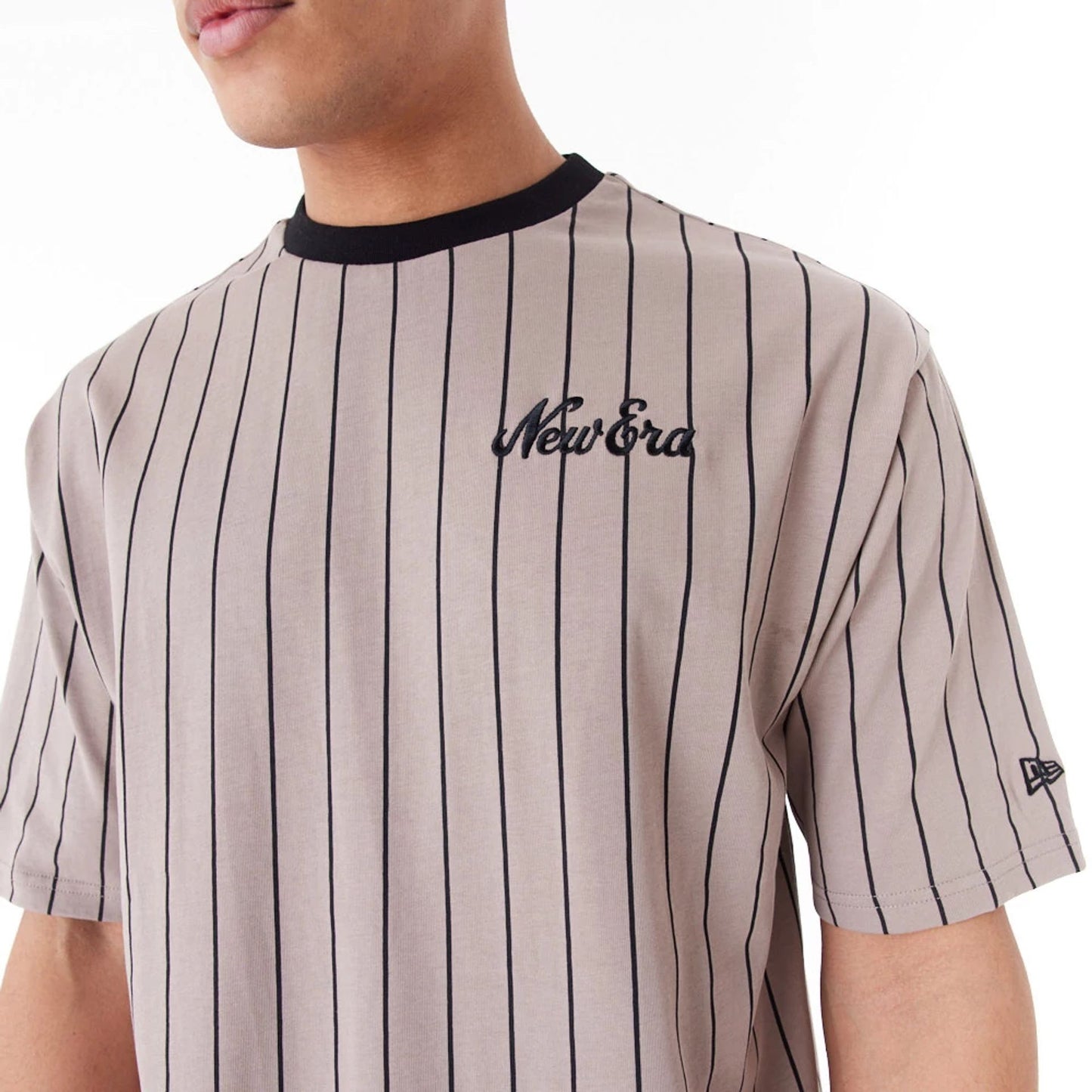 The Male model is wearing New Era Pinstripe Brown Oversized T-Shirt 2