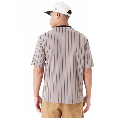 The Male model is wearing New Era Pinstripe Brown Oversized T-Shirt 4