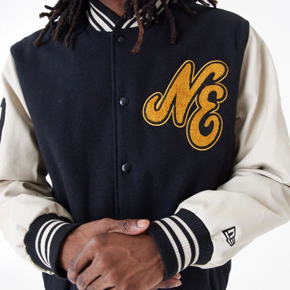 The Male model is wearing New Era Script Logo Black Varsity Jacket 6