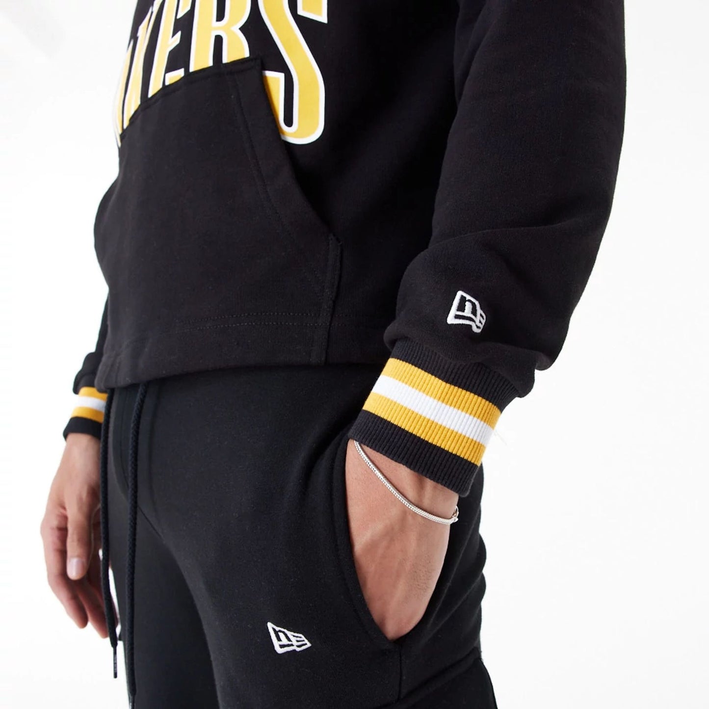 The Male model is wearing LA Lakers NBA Arch Graphic Black Oversized Pullover Hoodie 4