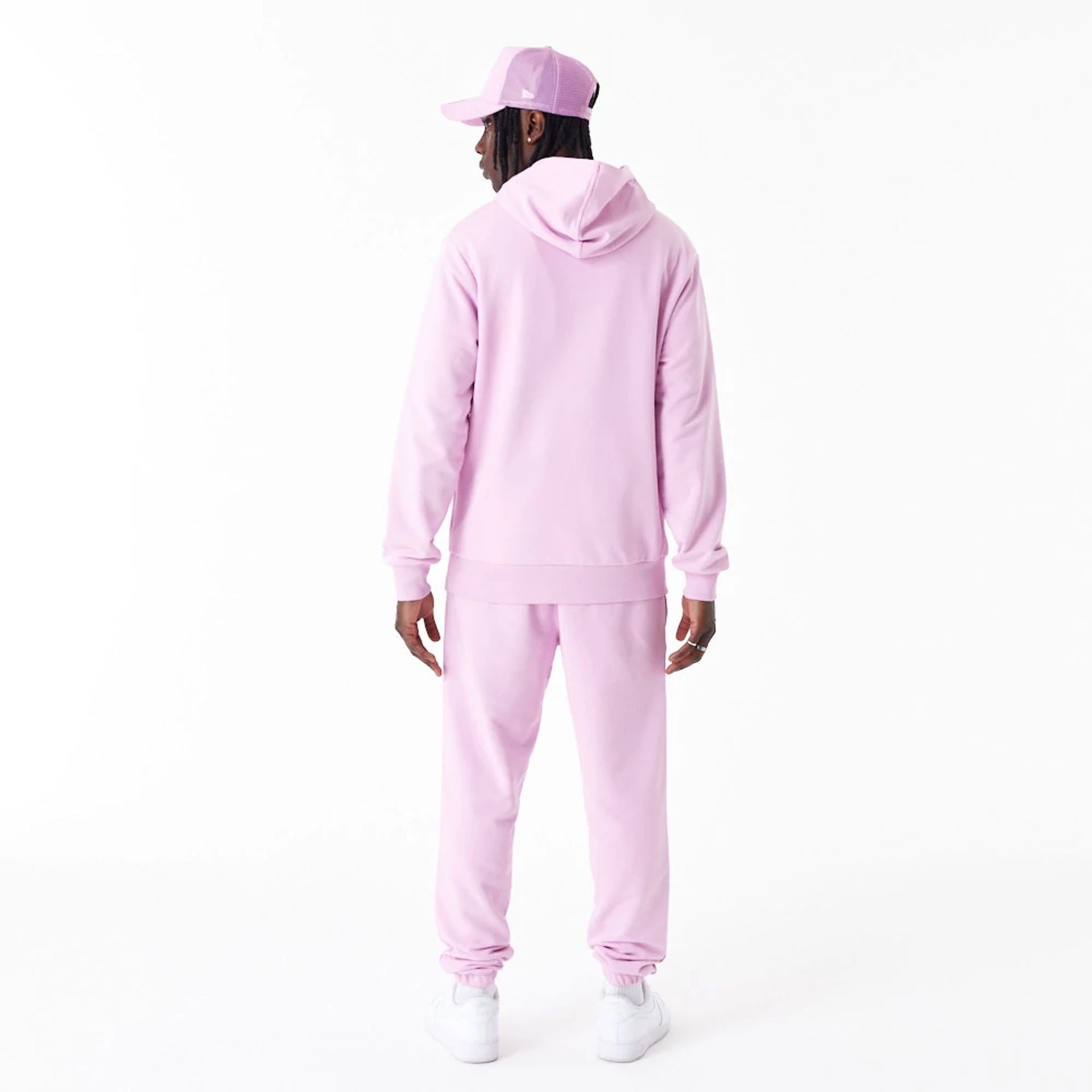 The Male model is wearing New Era Essential Pink Pullover Hoodie 2