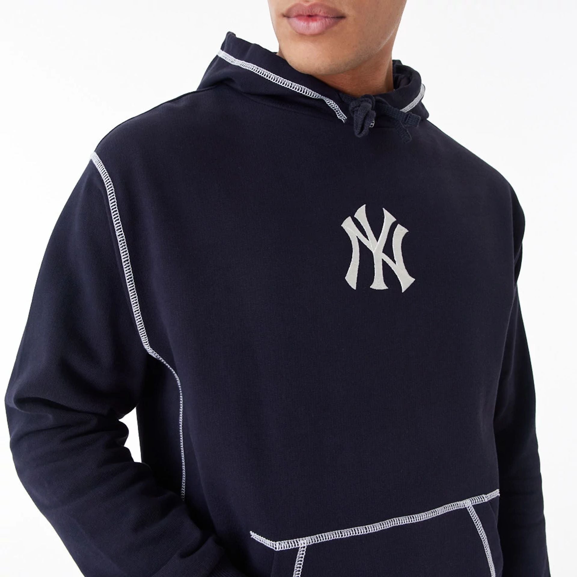 The Male model is wearing New York Yankees MLB World Series Navy Oversized Pullover Hoodie 2