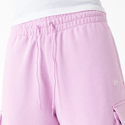 The Male model is wearing New Era Essential Pink Cargo Shorts 7