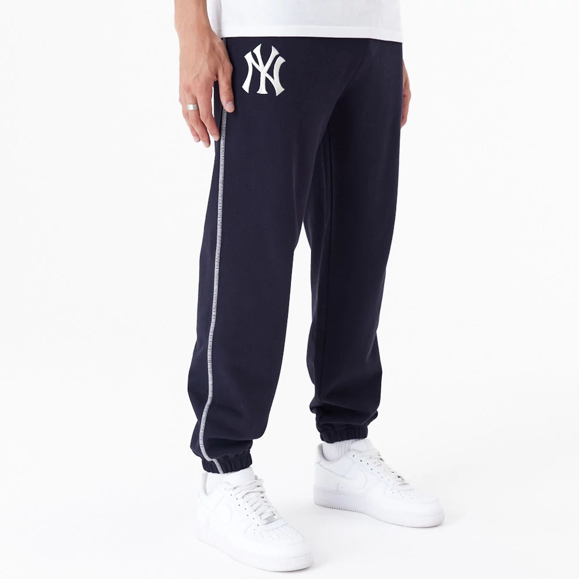 The Male model is wearing New York Yankees MLB Lifestyle Navy Joggers 1