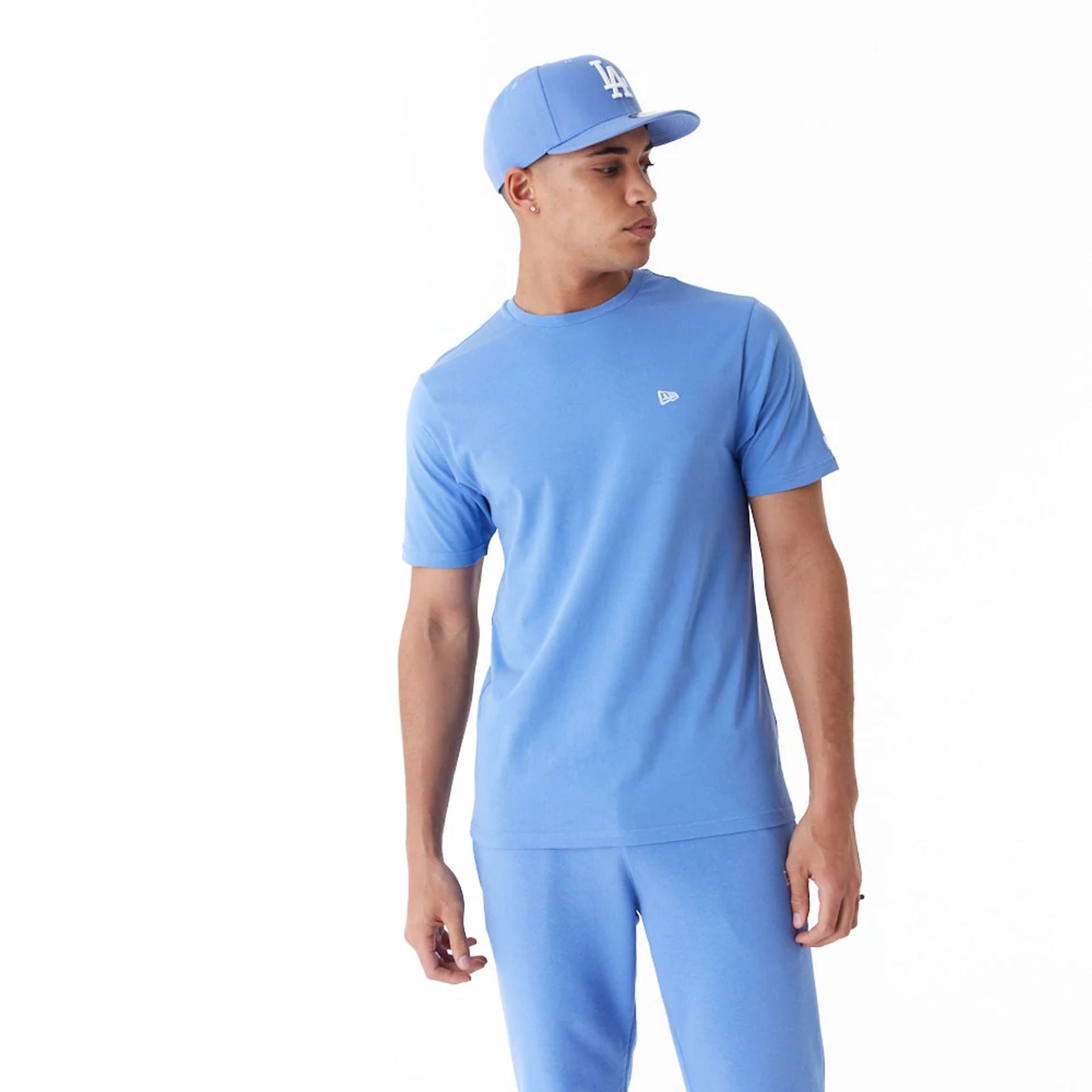 The Male model is wearing New Era Essential Blue T-Shirt 11