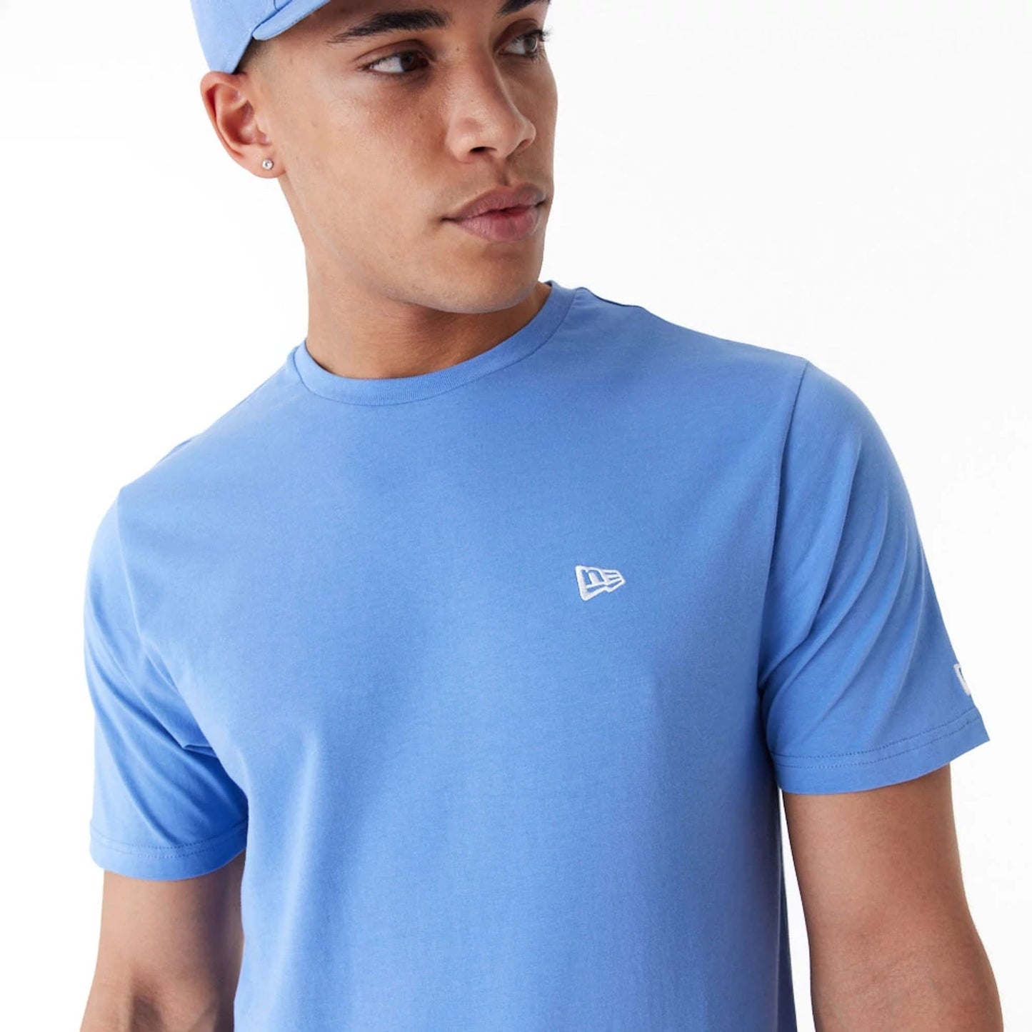 The Male model is wearing New Era Essential Blue T-Shirt 4