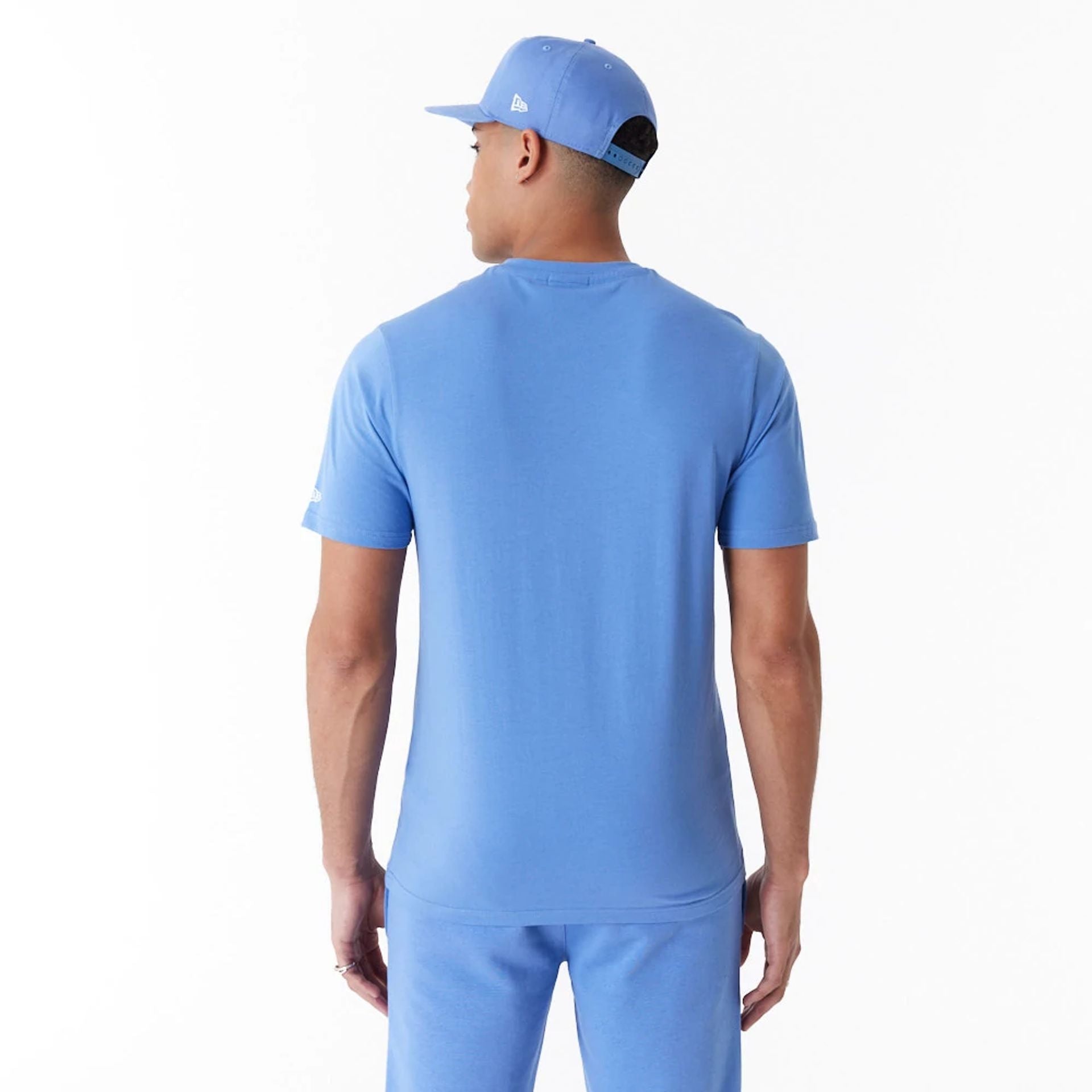 The Male model is wearing New Era Essential Blue T-Shirt 5