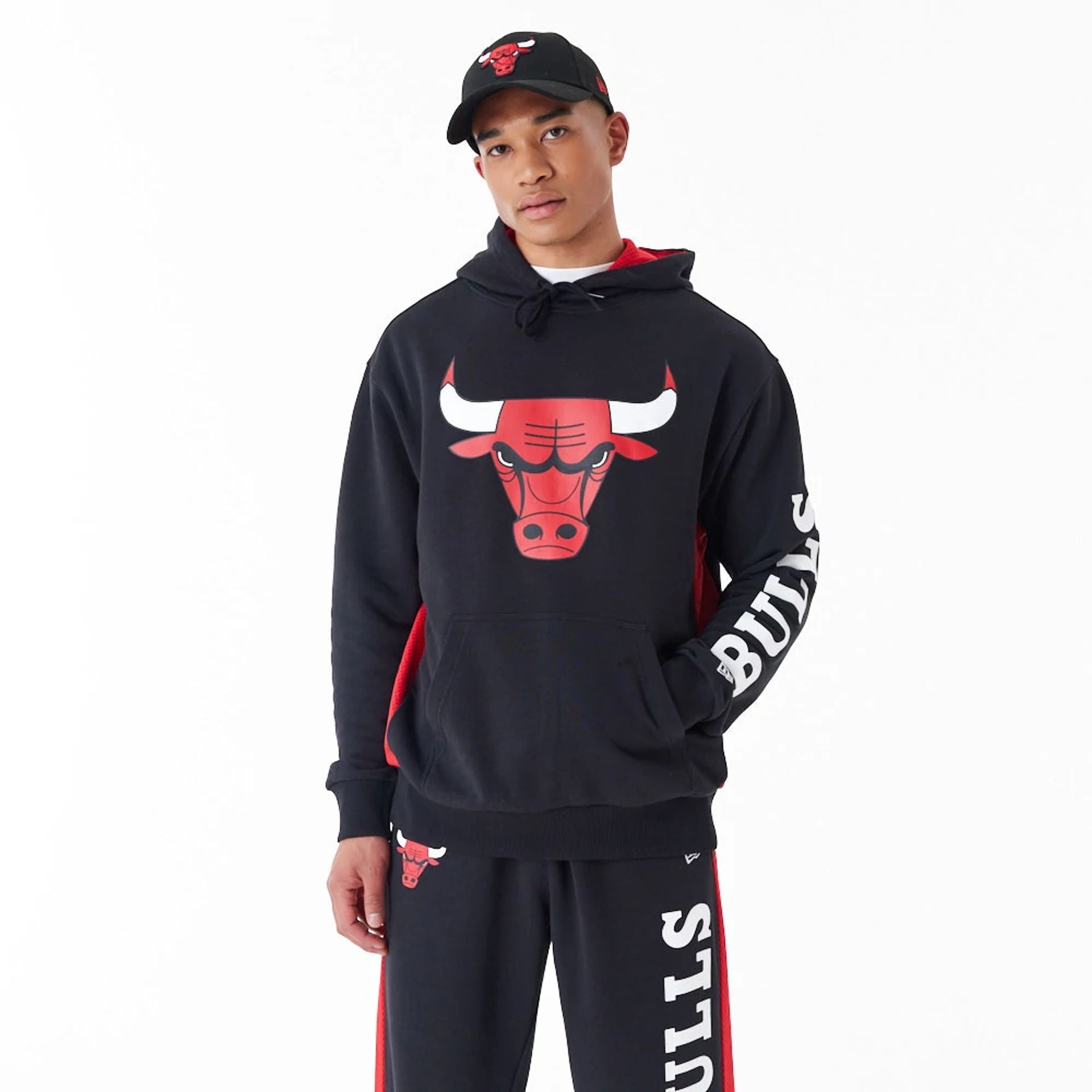 The Male model is wearing Chicago Bulls NBA Mesh Panel Black Oversized Pullover Hoodie 1