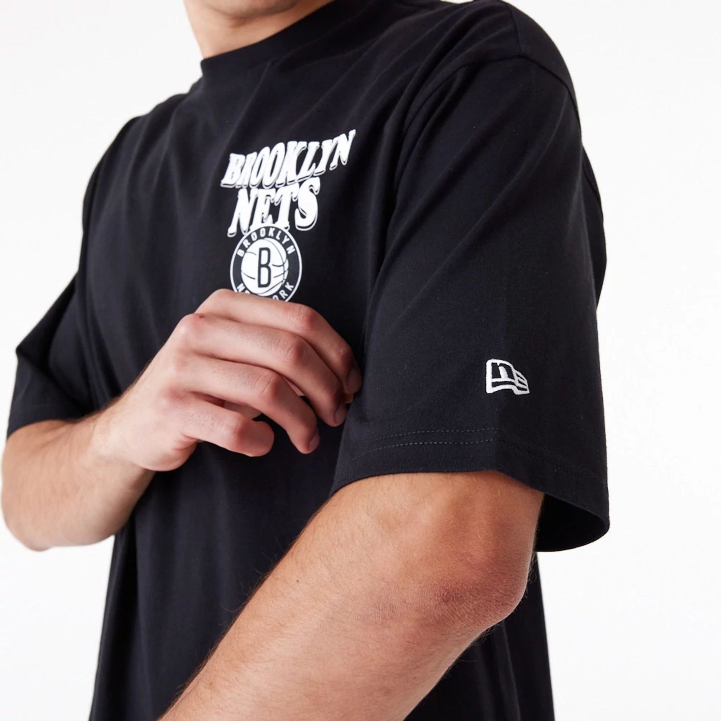 The Male model is wearing Brooklyn Nets NBA Script Black Oversized T-Shirt 4