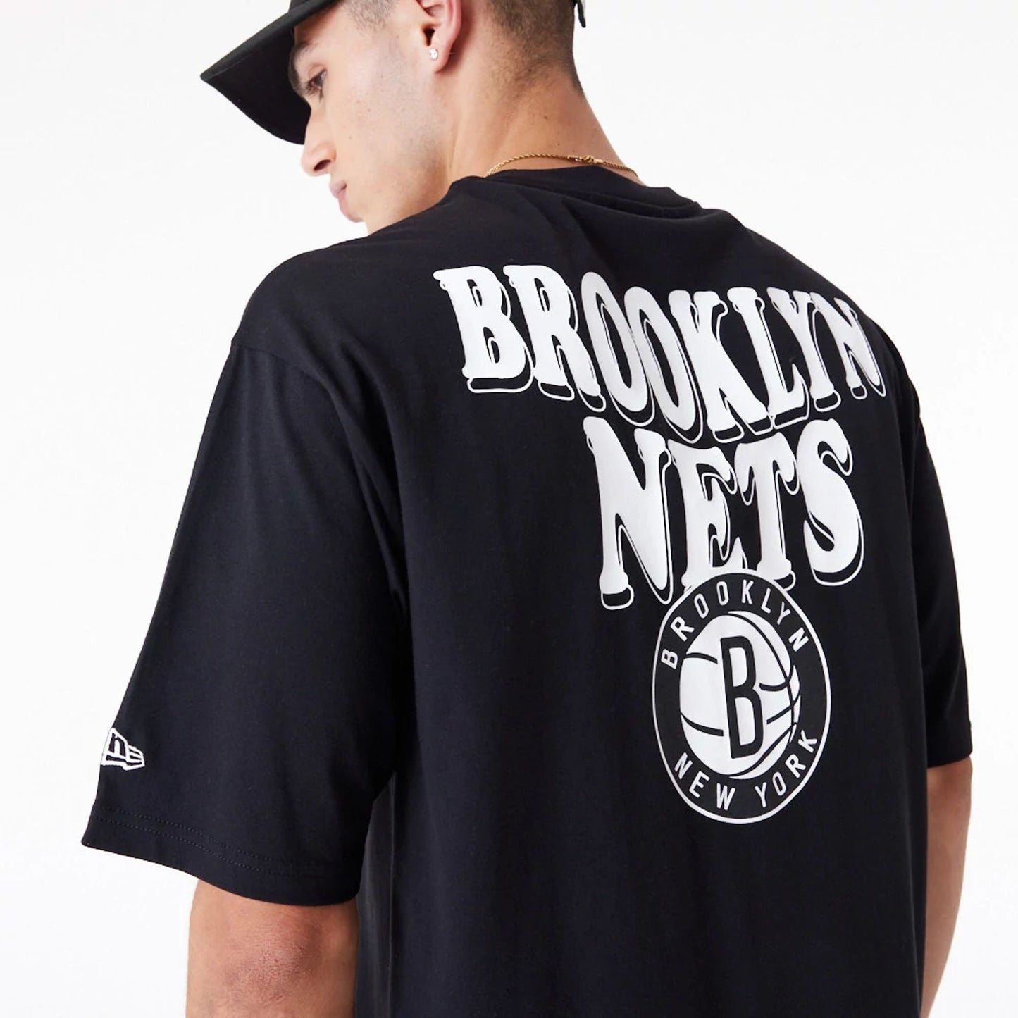 The Male model is wearing Brooklyn Nets NBA Script Black Oversized T-Shirt 2