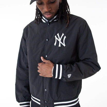 The Male model is wearing New York Yankees MLB Team Wordmark Black Bomber Jacket 6