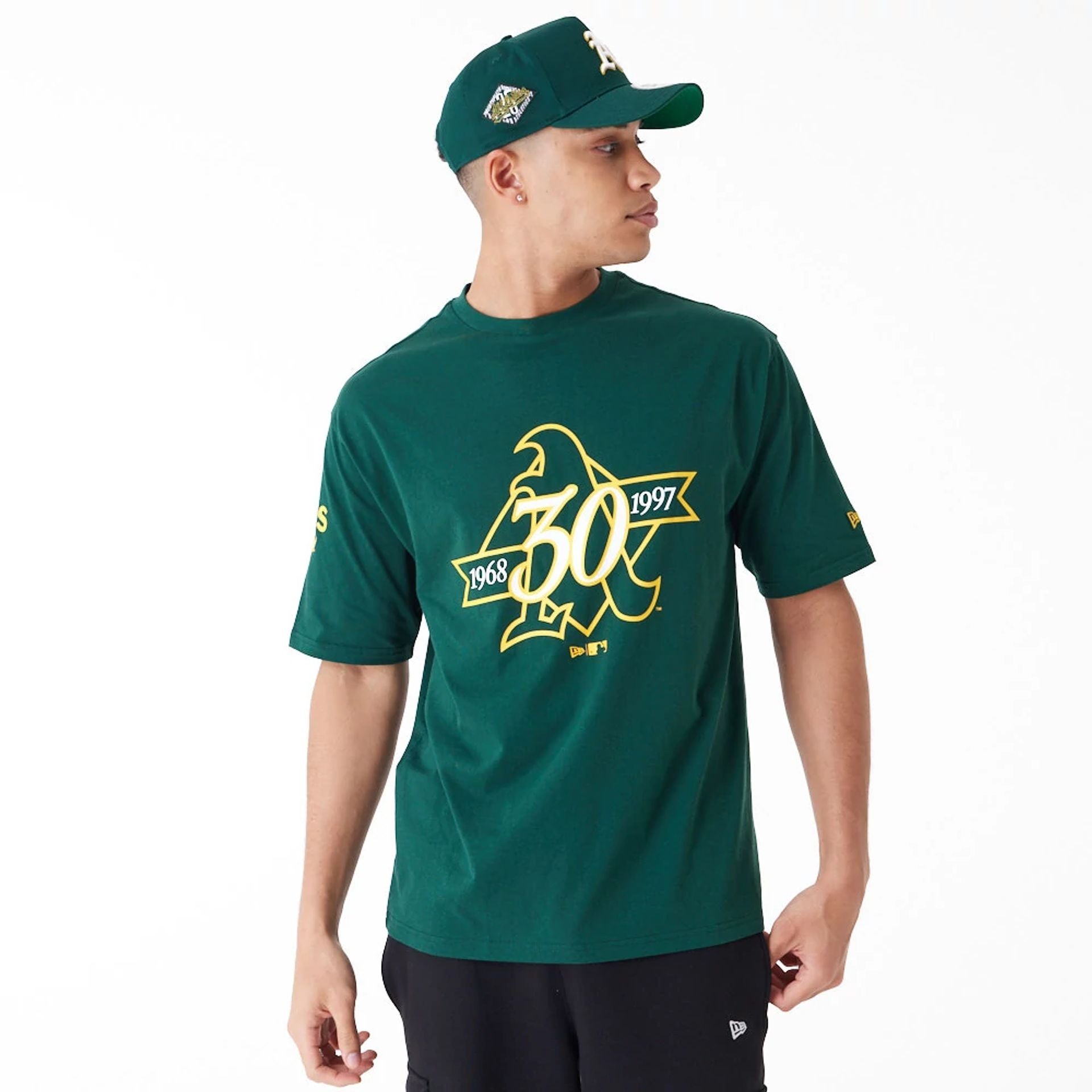 The Male model is wearing Oakland Athletics MLB Anniversary Green Oversized T-Shirt 1